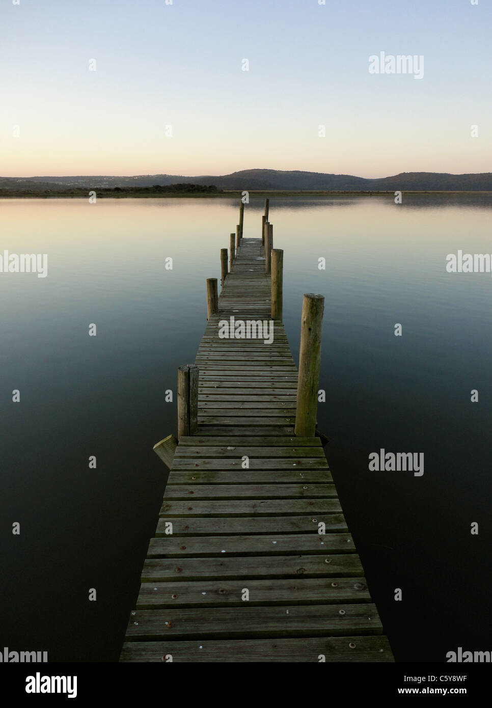 a jetty protrudes into a tranquil river Stock Photo - Alamy