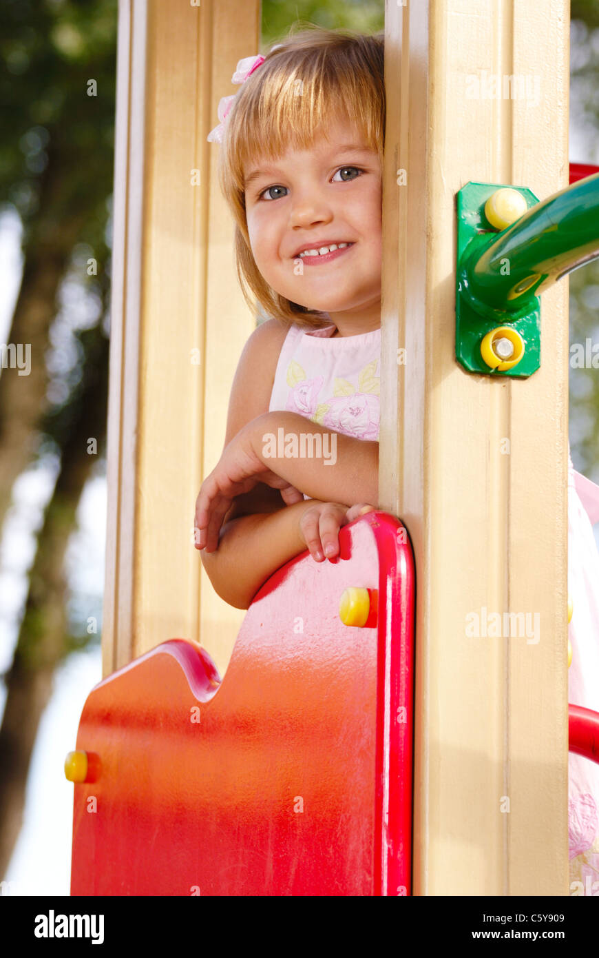 Happy smiling little girl at the playground Stock Photo - Alamy