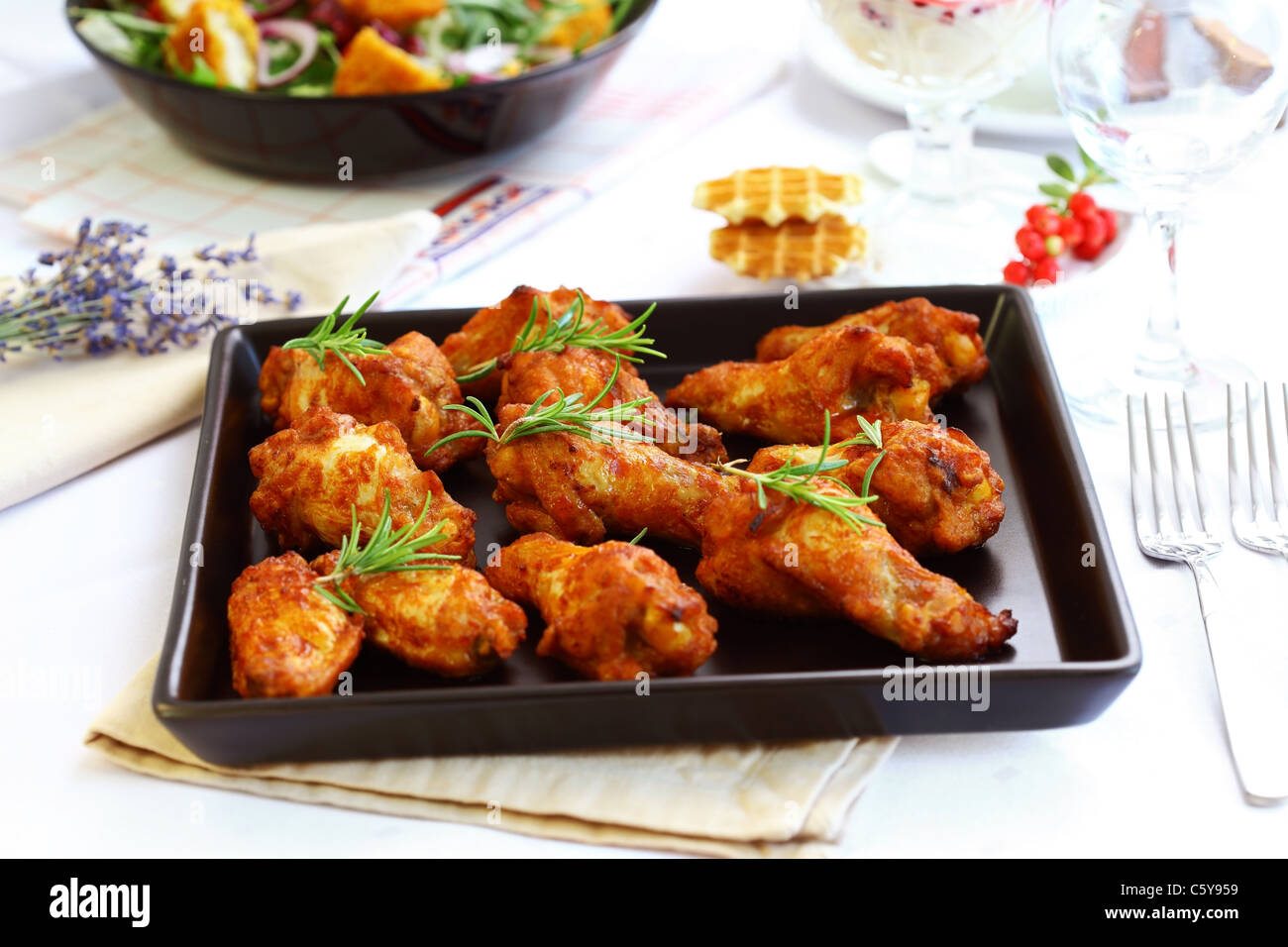 Hot chicken wings on baking tray Stock Photo