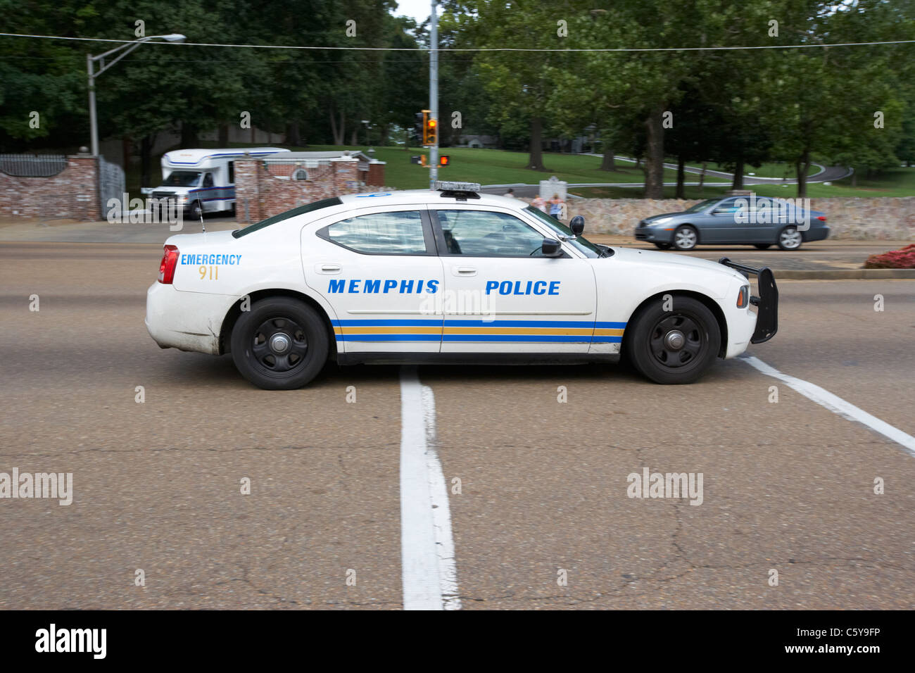memphis police patrol car speeds down elvis presley boulevard outside graceland memphis tennessee usa Stock Photo