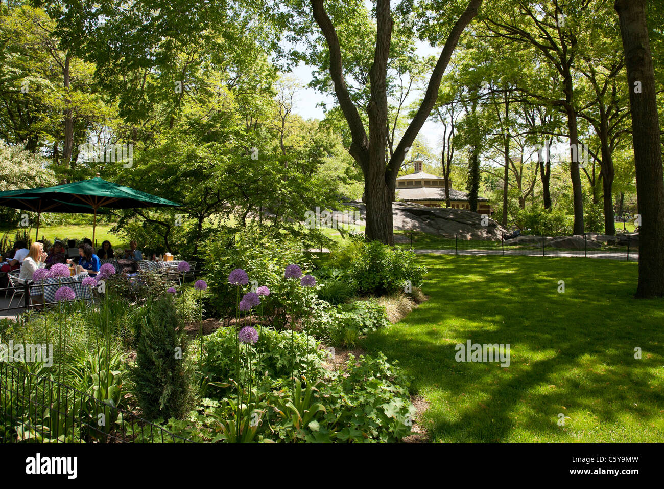 Central Park, Outdoor Tables, Heckscher Ballfields, Carousel in background, Central Park, NYC Stock Photo