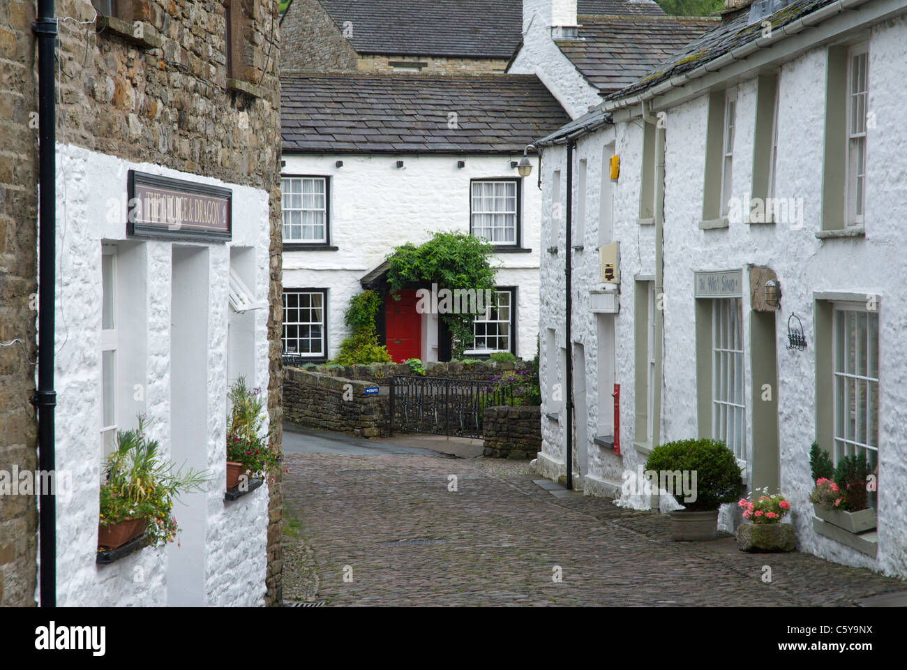 Whitewashed houses lining cobbled street in Dent, Cumbria, England UK Stock Photo Alamy