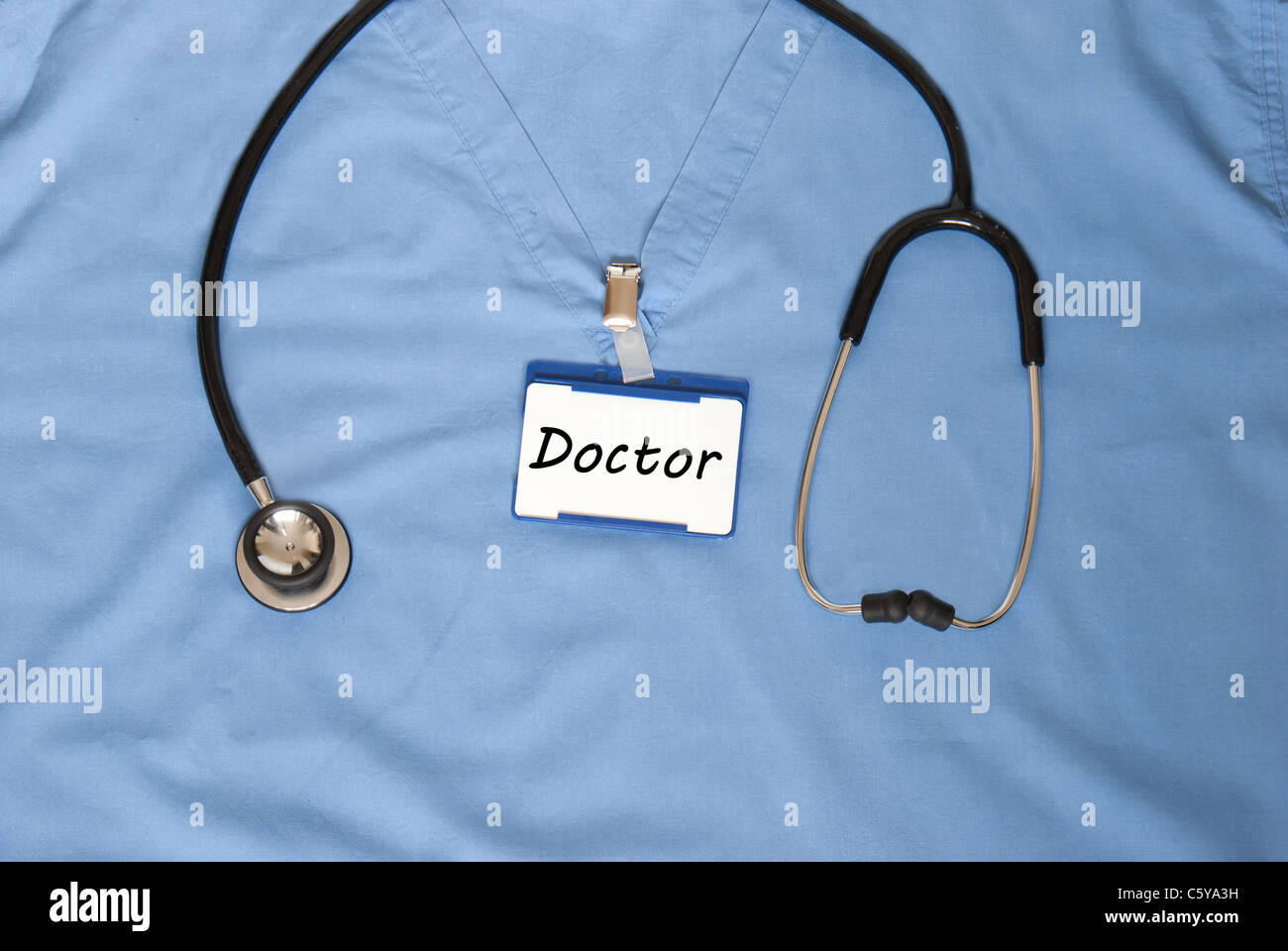 Doctor depicted with scrubs and a stethoscope Stock Photo