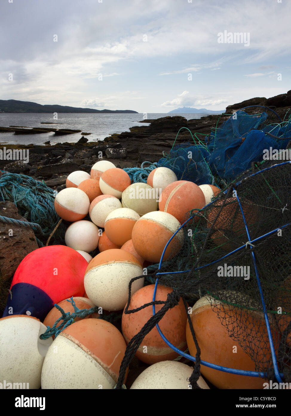 Discarded fishing floats and nets washed ashore on the Isle of Skye, Scotland, UK Stock Photo