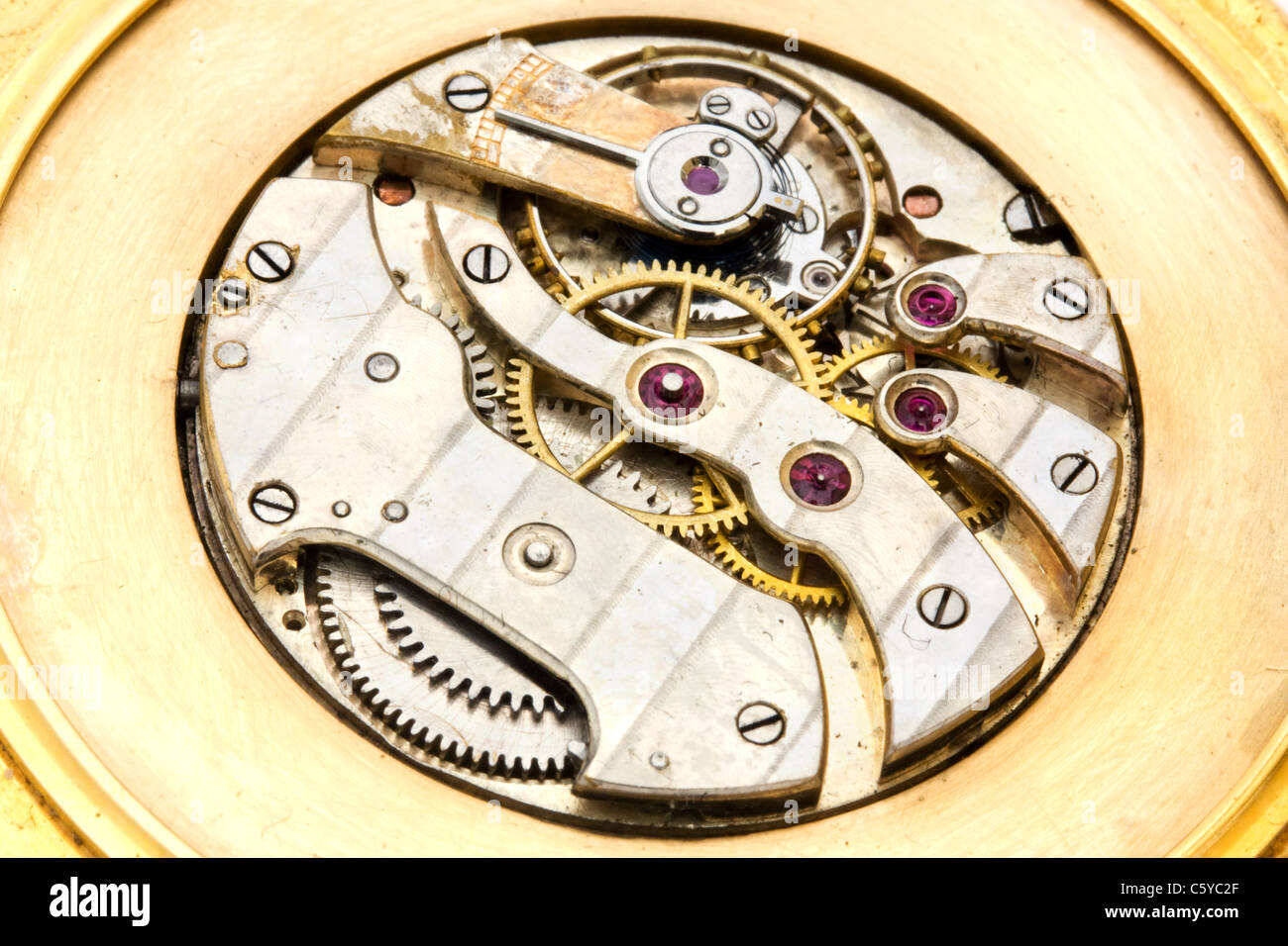 Inside workings of a gold watch Stock Photo