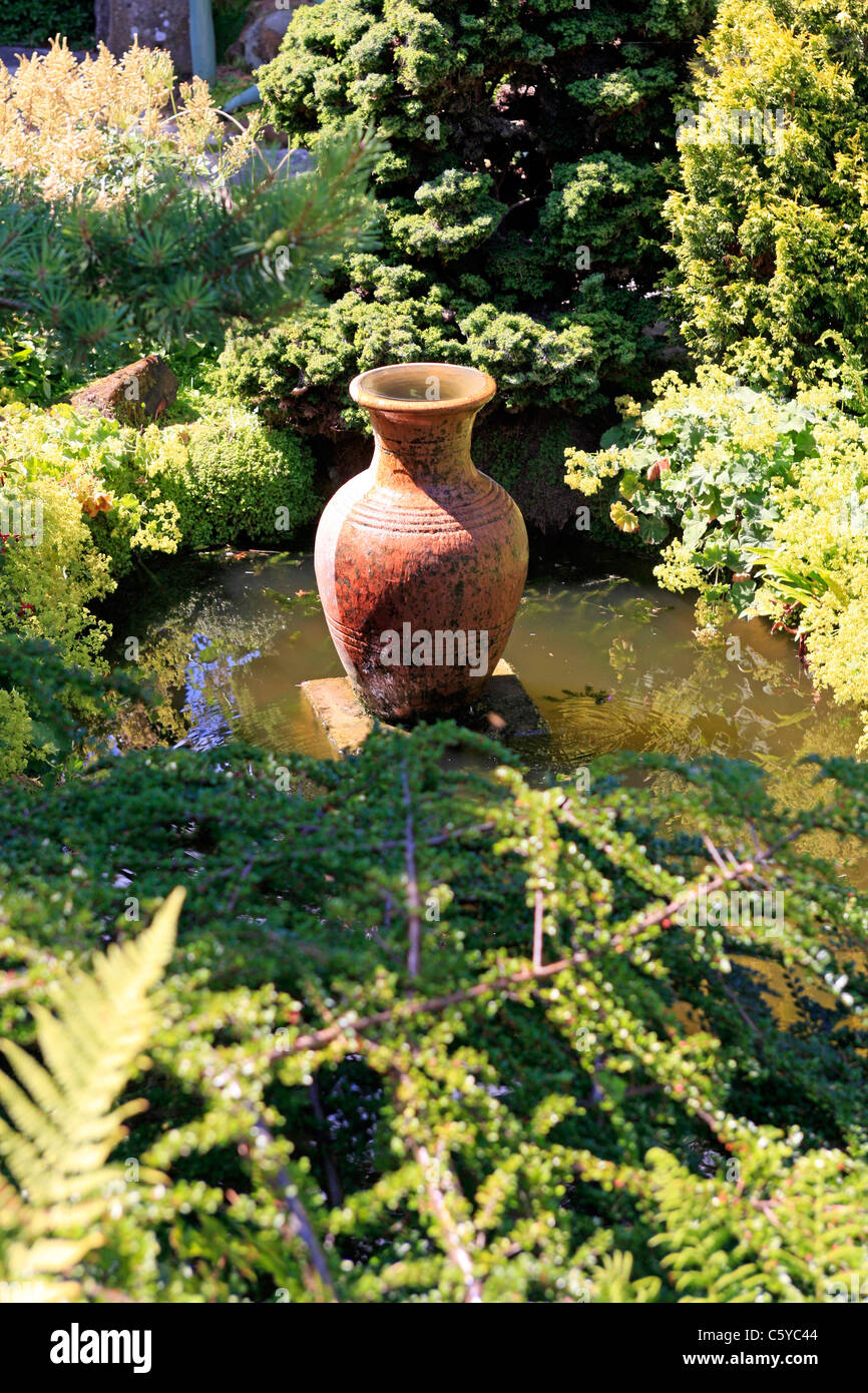 Grecian Urn as a water feature in a Garden Stock Photo Alamy