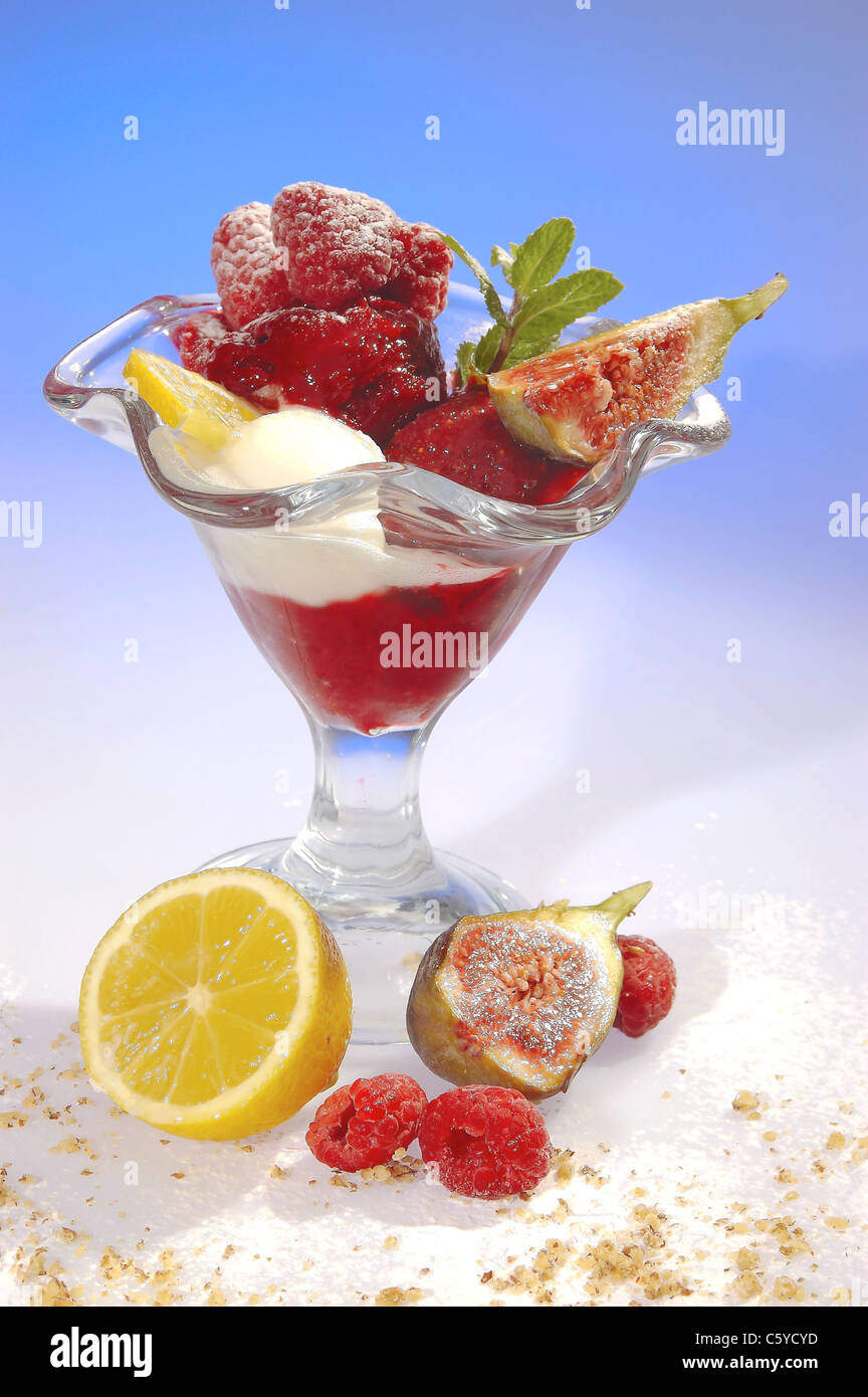 Raspberry sundae w sour cream and fig Stock Photo - Alamy