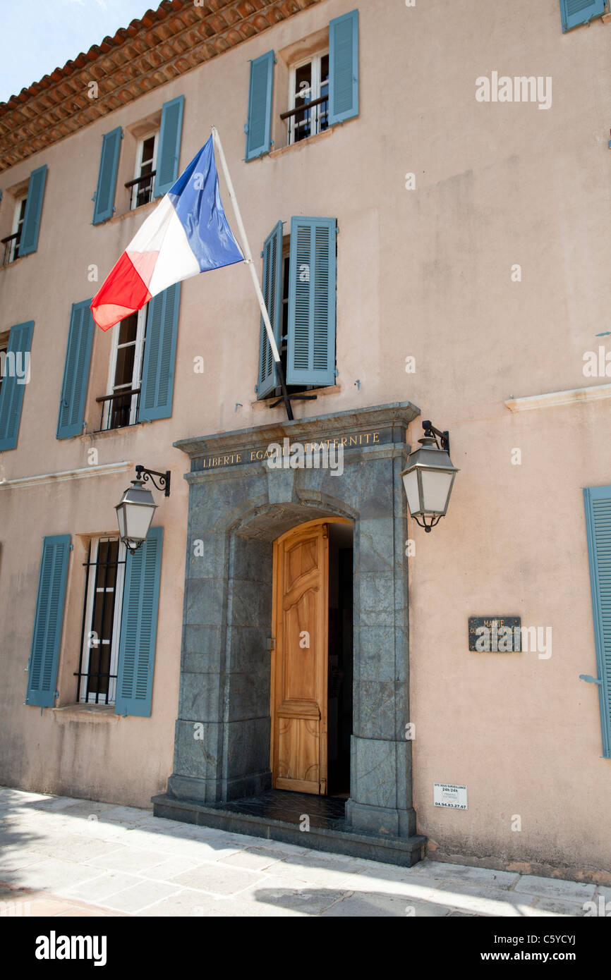 Grimaud Town Hall building facade in Provençal colors with flag. Var 83 France Stock Photo