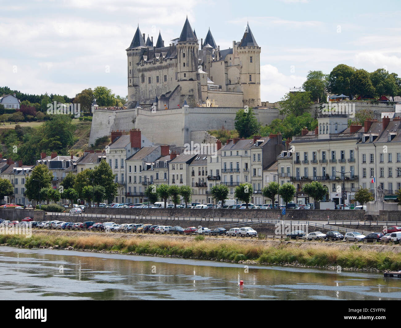 The castle of Saumur rises above the town on the bank of the Loire river, France Stock Photo