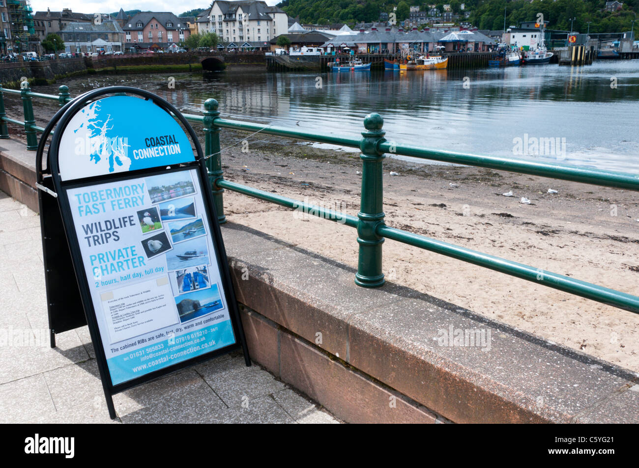 A sign at Oban harbour advertising boat trips and wildlife watching trips. Stock Photo