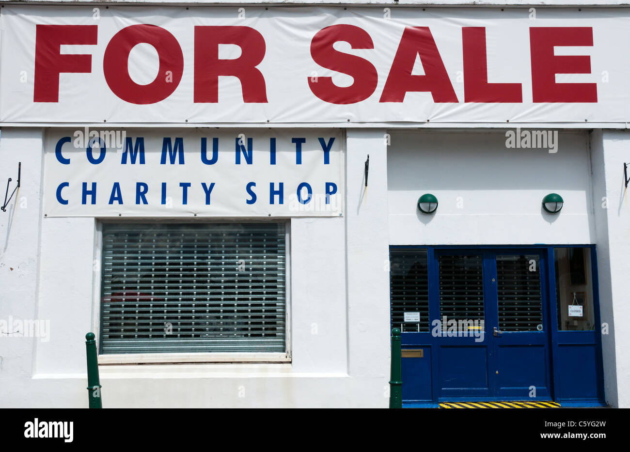 For Sale and Community Charity Shop signs Stock Photo