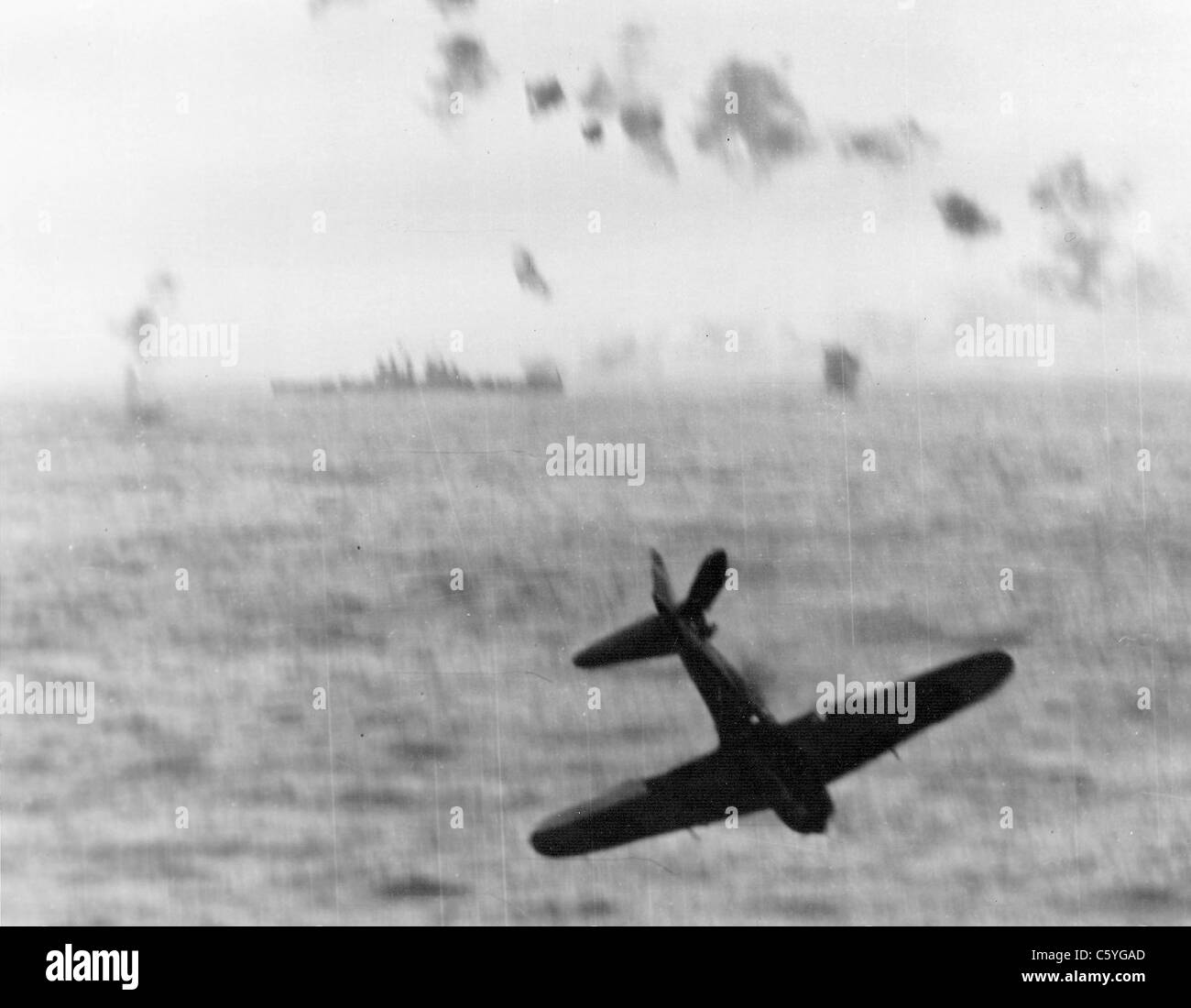 KAMIKAZE Japanese Mitsubishi A6M5 Zero crashes after attacking USS Essex off Okinawa in 1945. Photo US Navy Stock Photo
