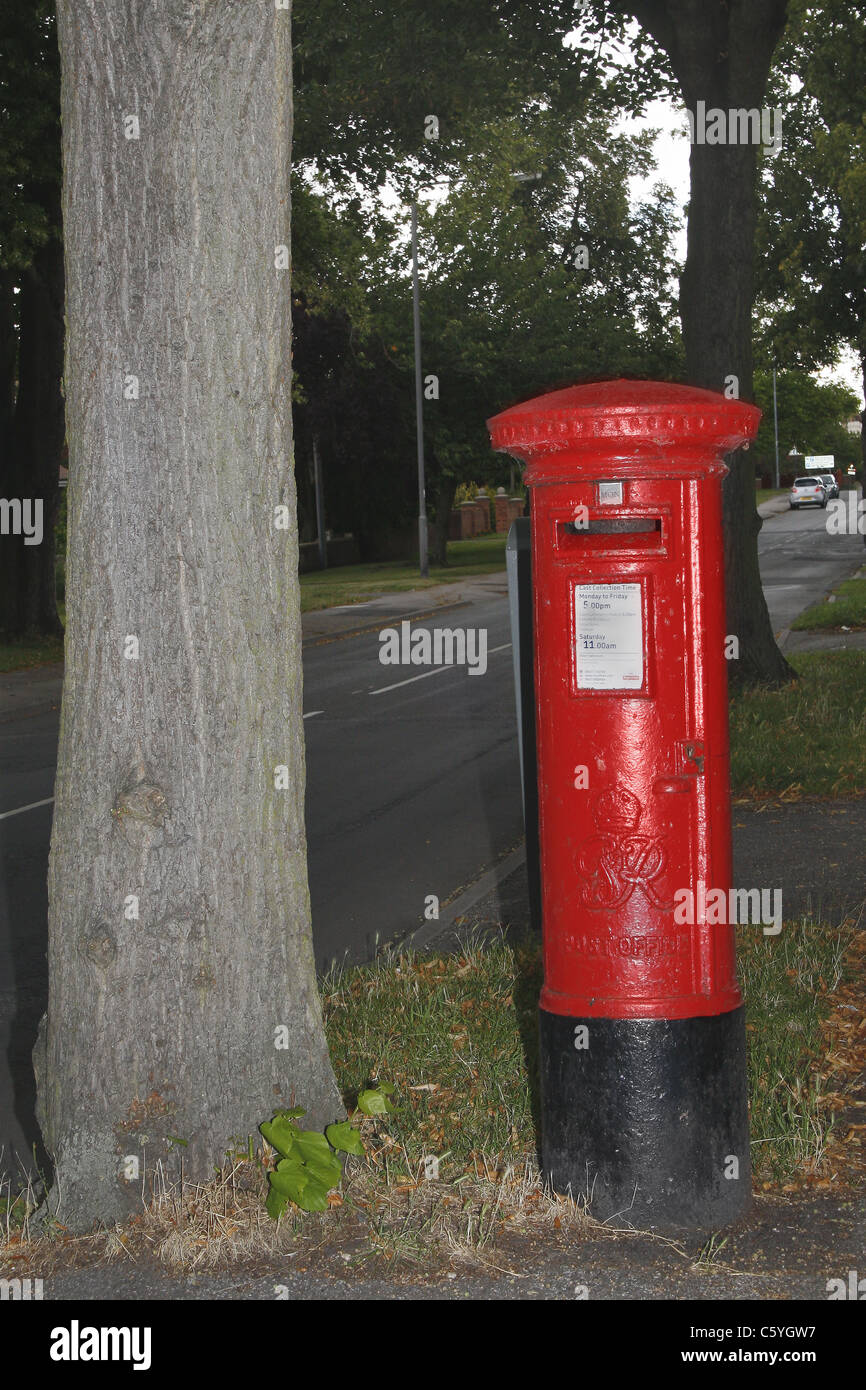 postbox beside tree, Sparken Hill, Worksop, Notts, England Stock Photo