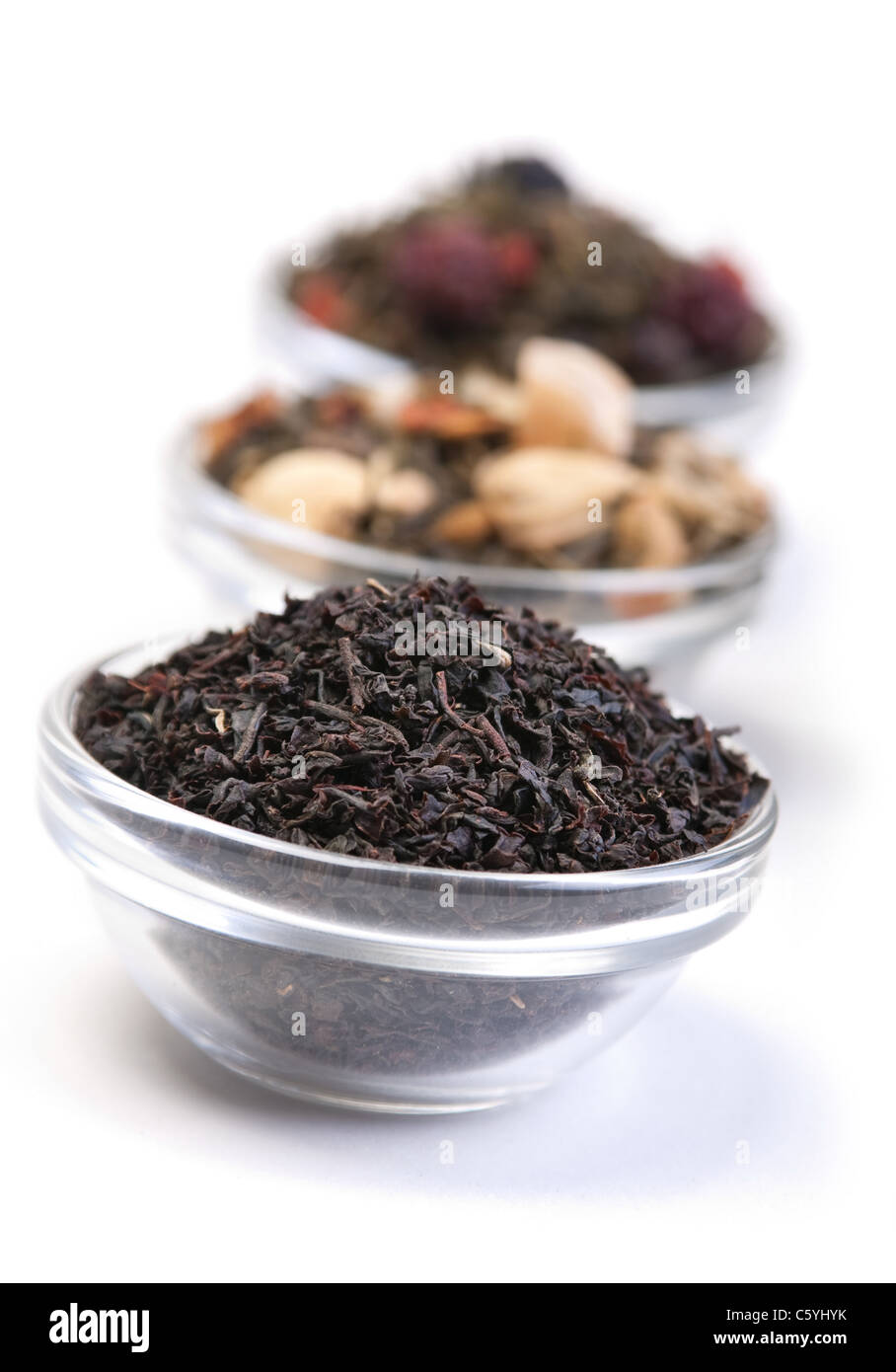 Tea herb in glass dishware on white background Stock Photo
