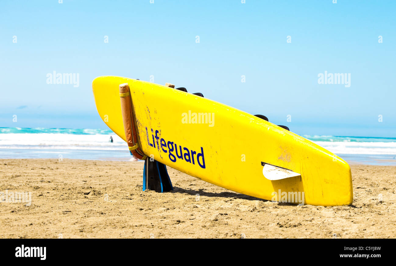Yellow surfboard on a beach Stock Photo Alamy