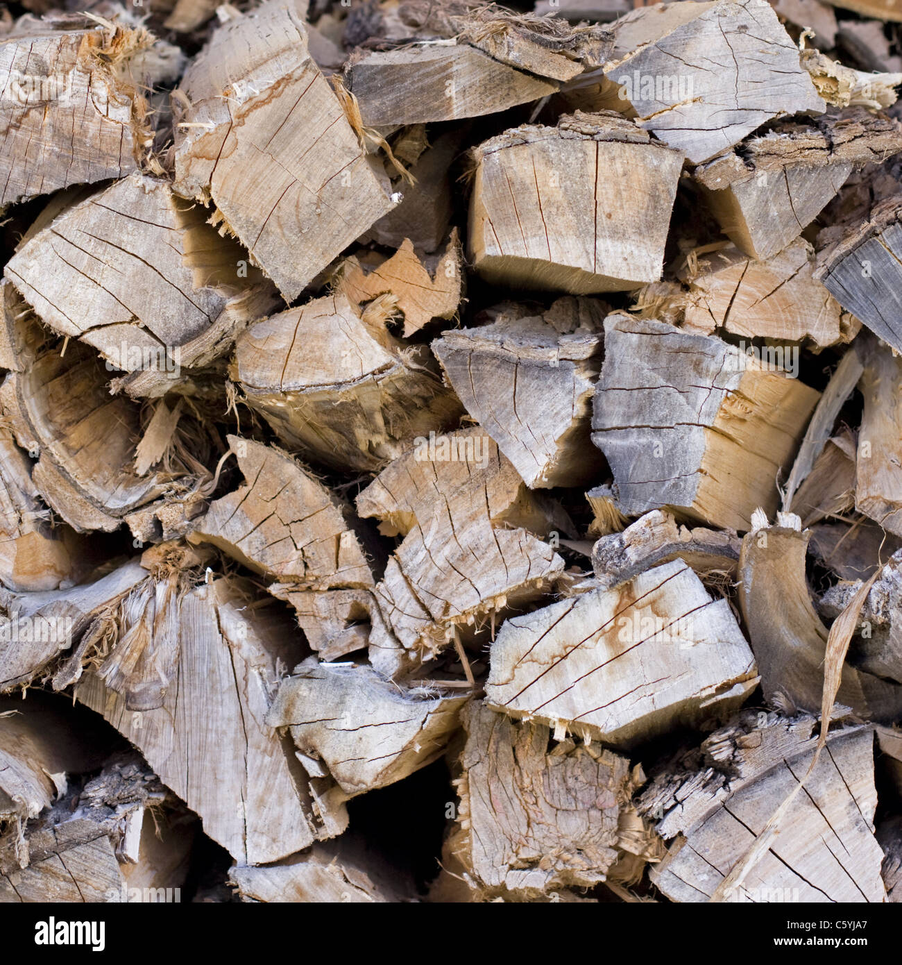 A stack of firewood stands ready for the coming winter heating season