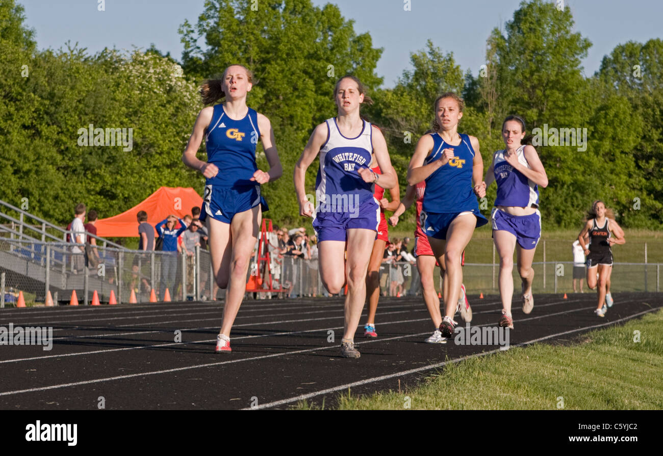 High school girls run elbow to elbow at the sectional track meet in ...