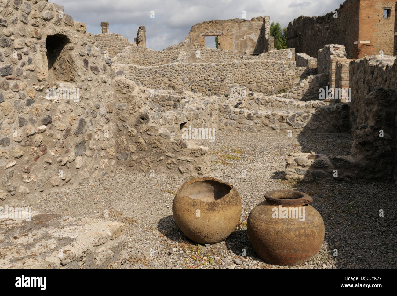 Clay pots in ruins of a bar, Thermopolium of Flavus Nicephorus, Pompeii Stock Photo