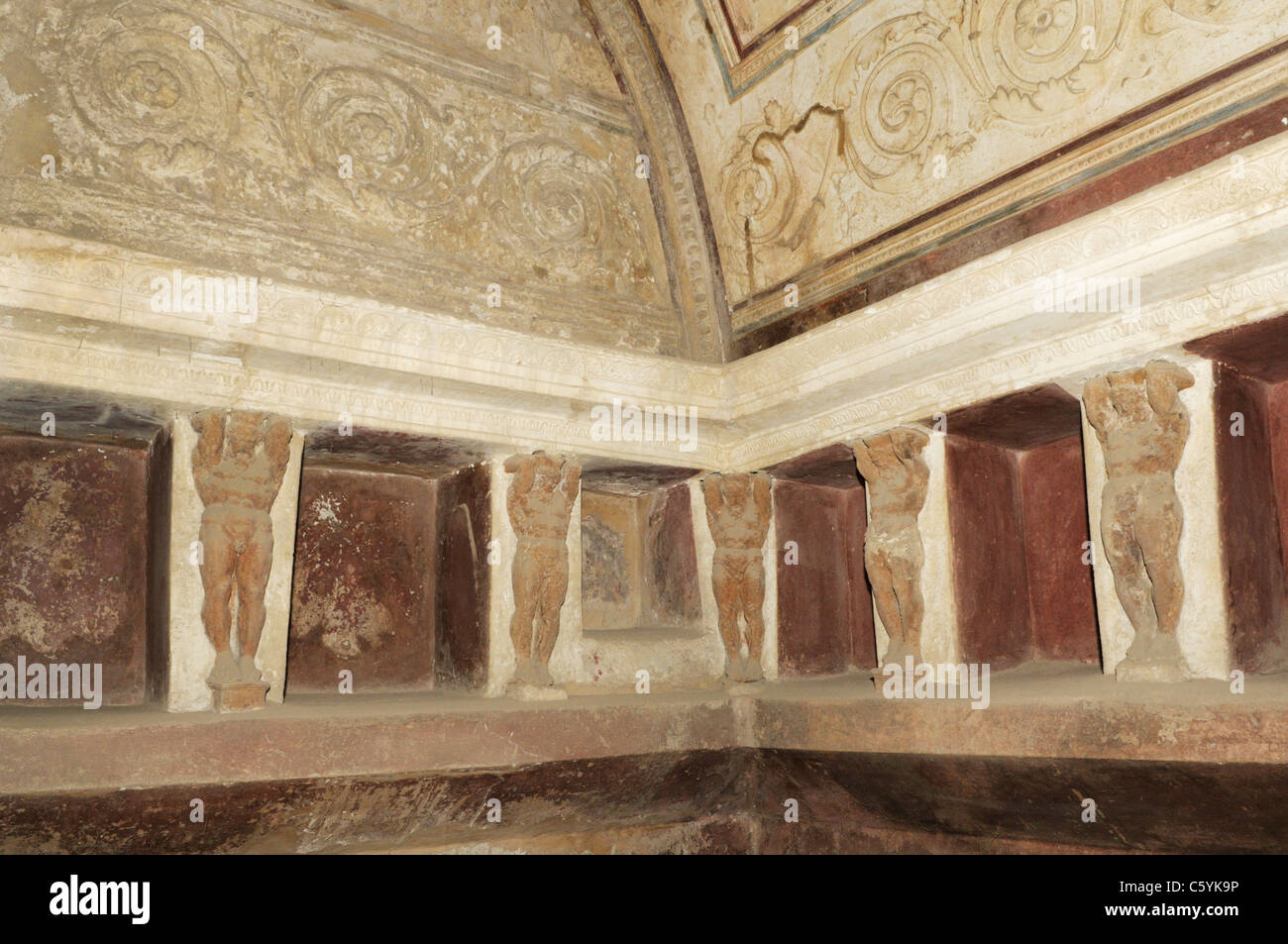 Pompeii forum baths.  Walls of the vault of the public baths with mythological figures. Stock Photo