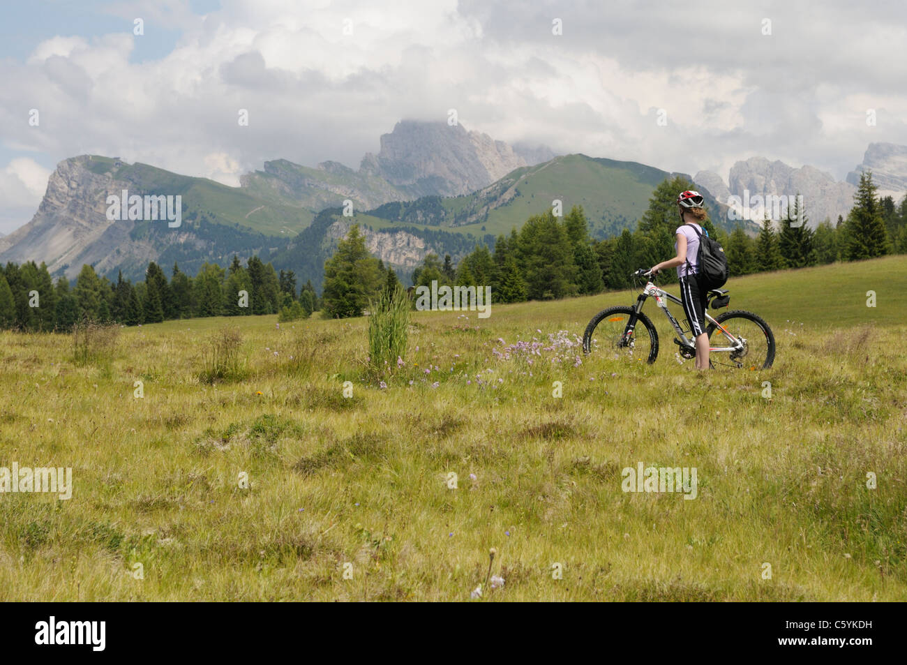 Girl, 12, on bike on the Alpe di Siusi near Val Gardena, Italy. Stock Photo