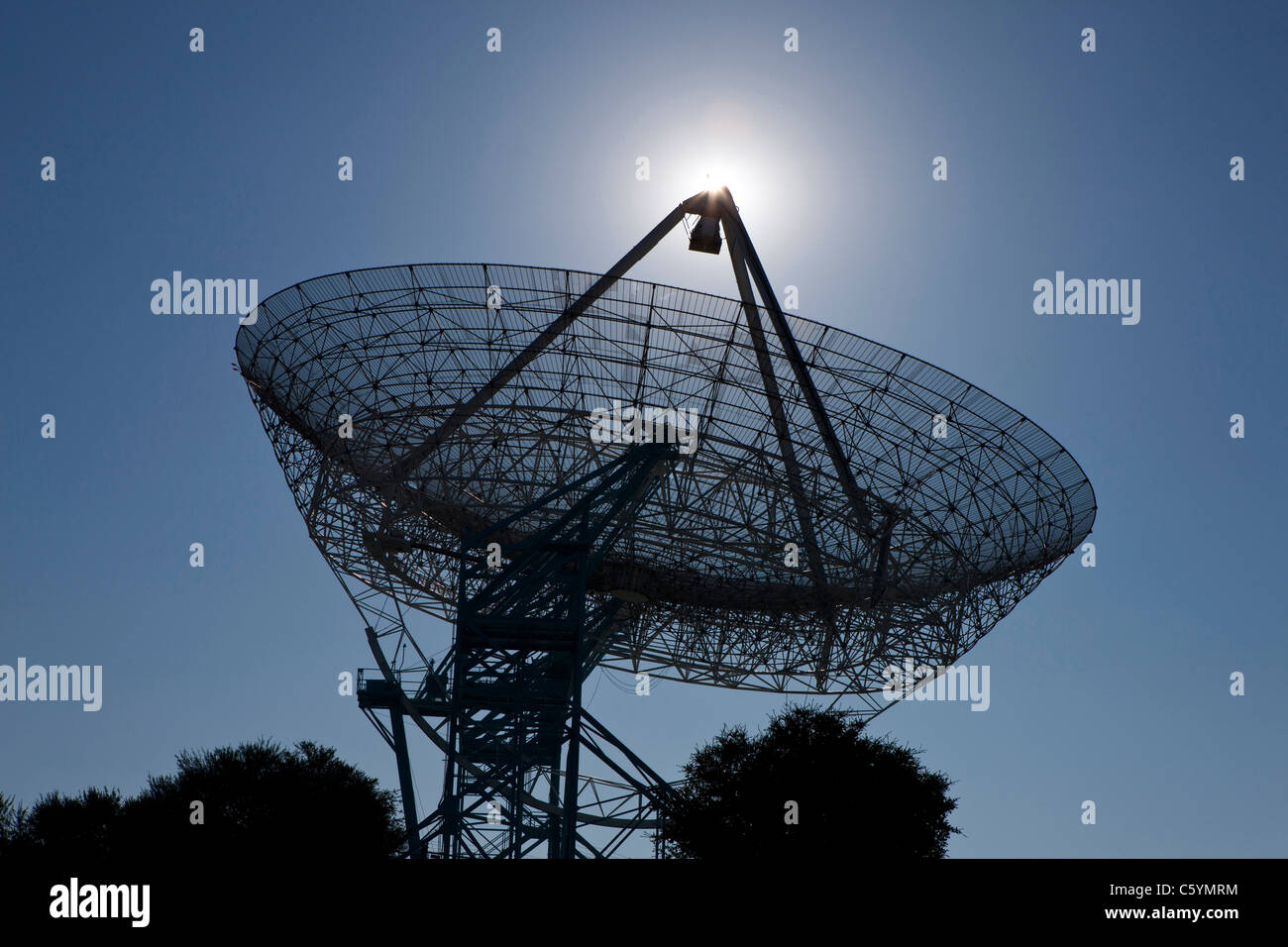 The sun sets behind The Stanford Dish, an active radio telescope, Stanford, California, United States of America Stock Photo