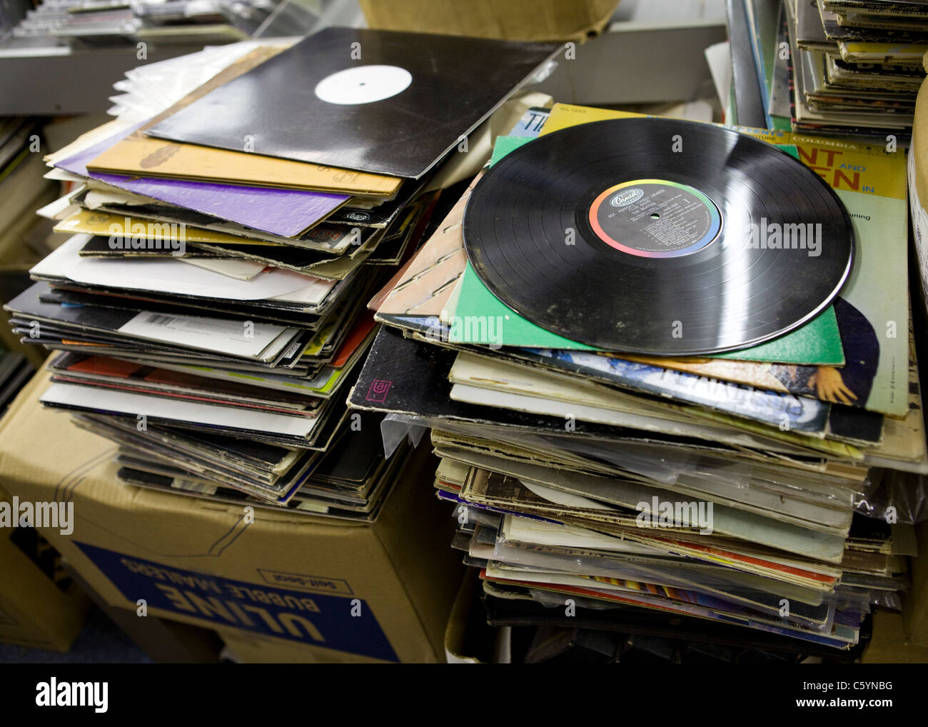 Used vinyl records stacked up for resale Stock Photo