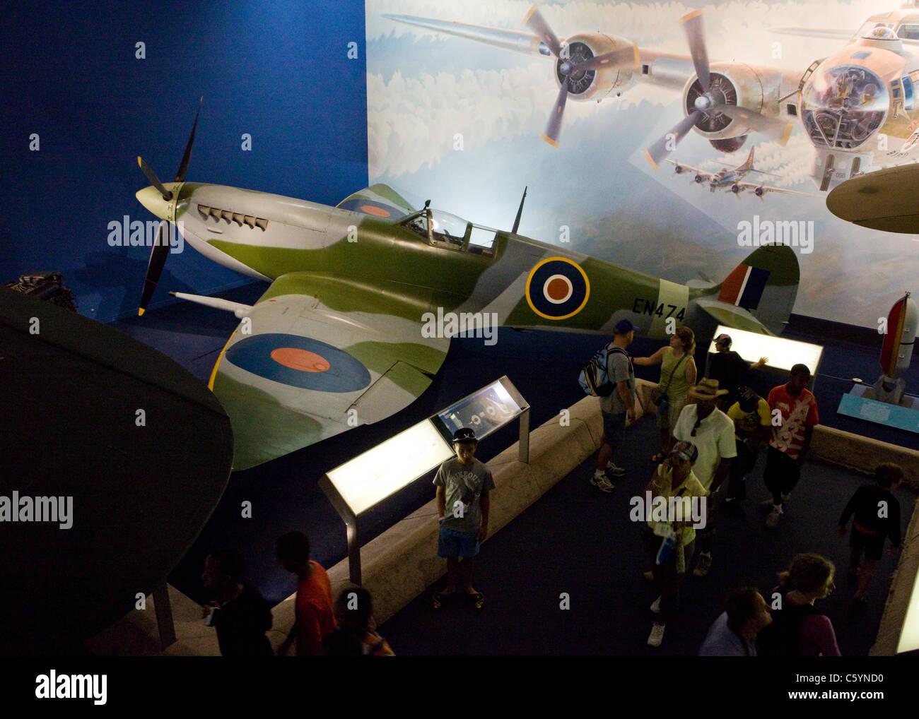 Visitors view a WWII-era British fighter aircraft, The Supermarine Spitfire - National Air and Space Museum - Washington, DC USA Stock Photo
