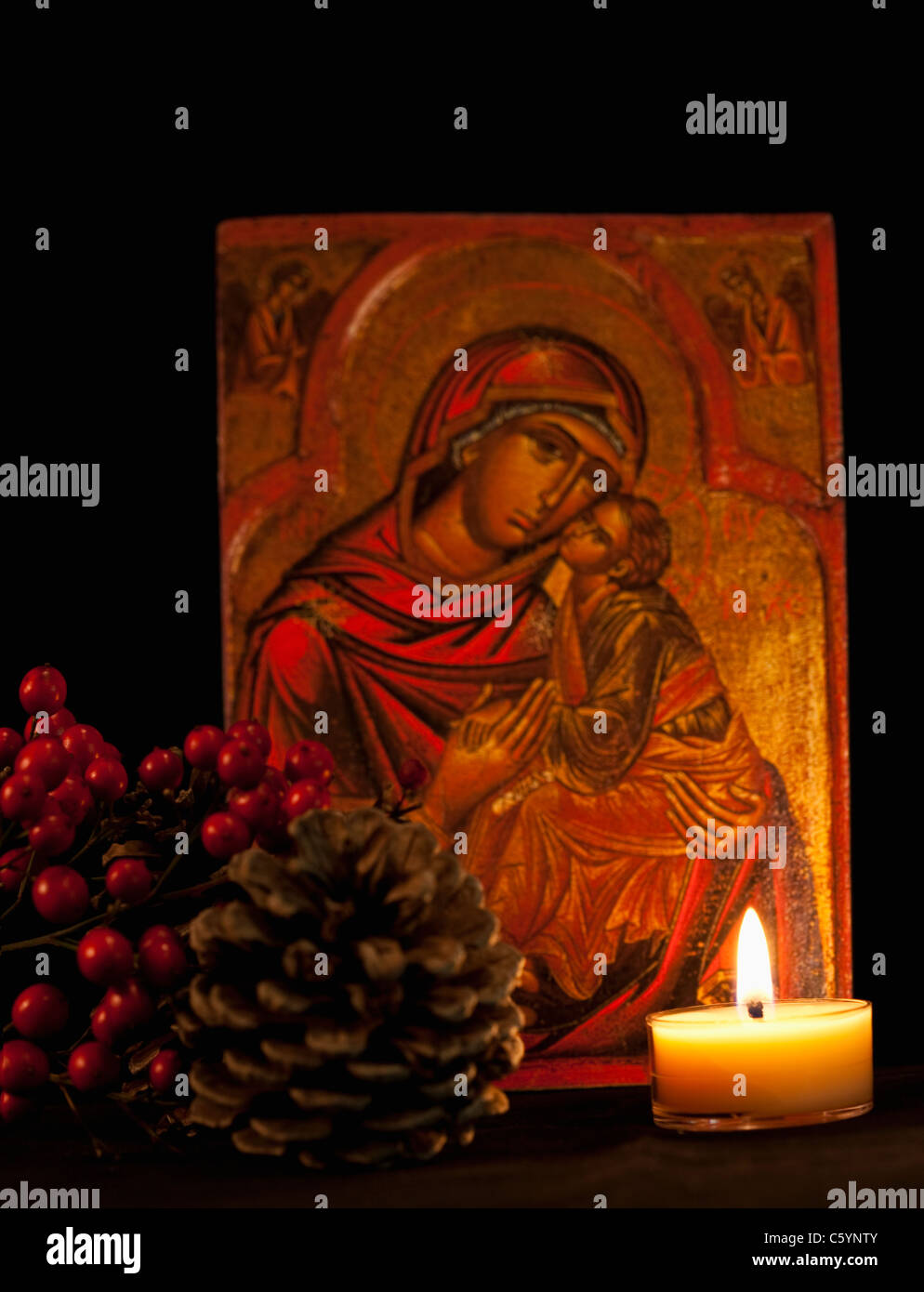 USA California, Fairfax, icon with Virgin Mary and Jesus, candle and pine cone Stock Photo