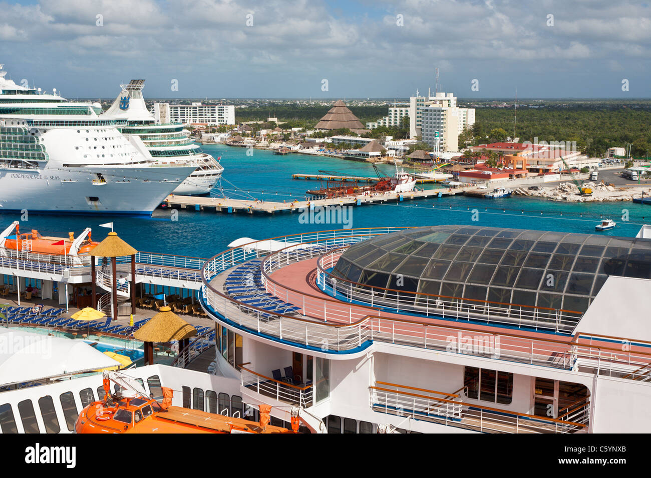 Carnival Ecstasy and two Royal Caribbean cruise ships at port in Cozumel, Mexico in the Caribbean Sea Stock Photo