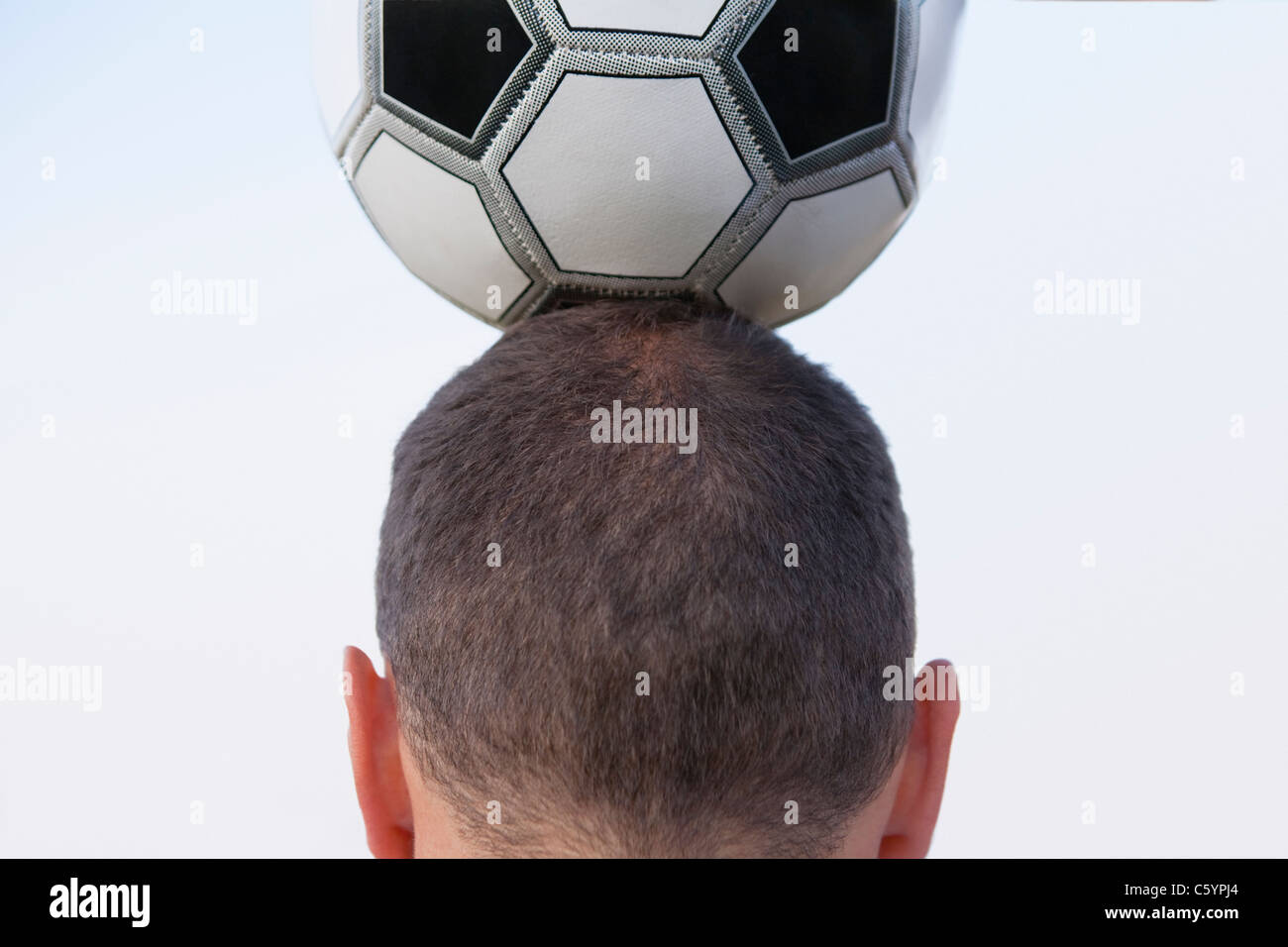 Russia, Voronezh, man holding soccer ball on head Stock Photo Alamy
