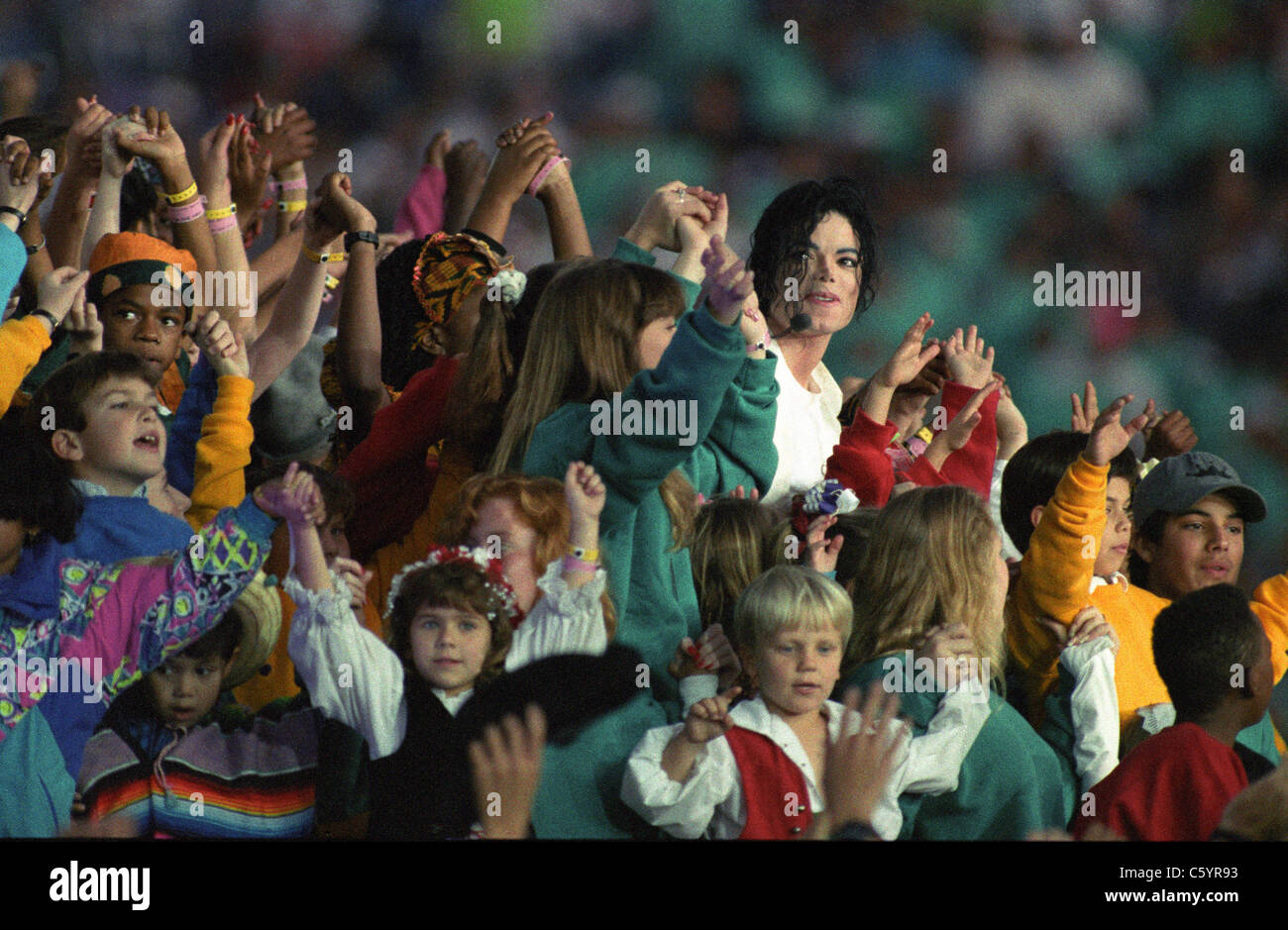 Michael Jackson performs with children from around the world during the 1993 Superbowl halftime show in Pasadena, California. Stock Photo