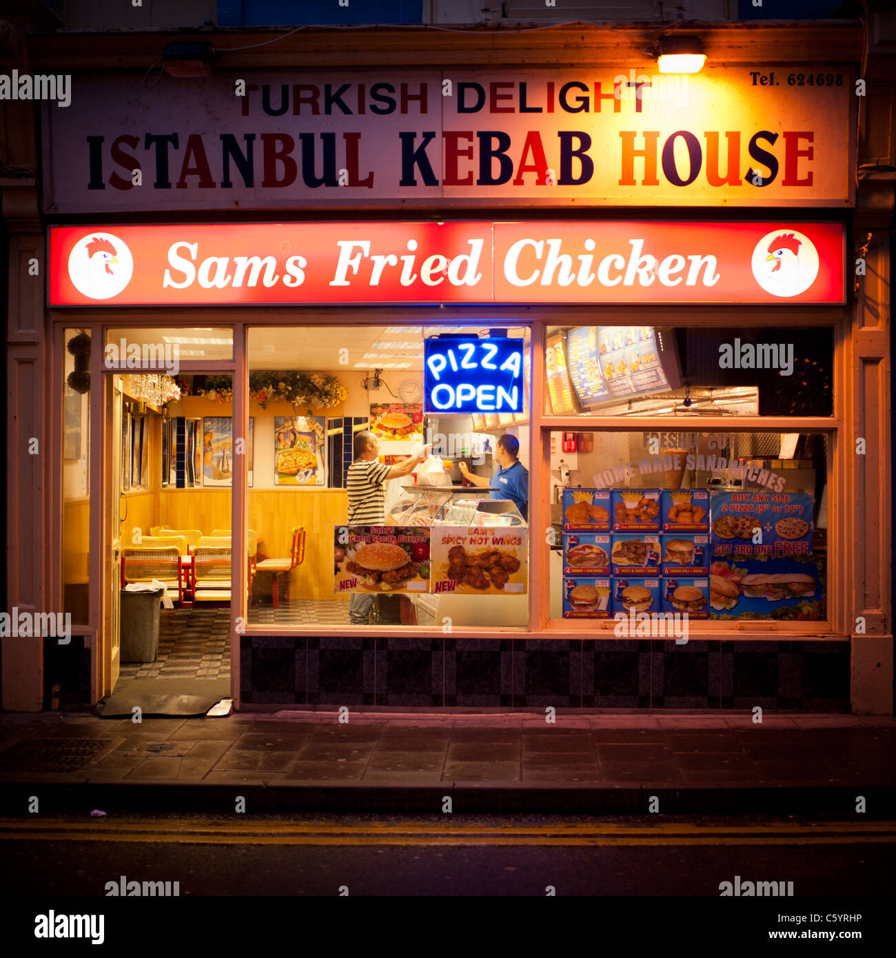 exterior, 'istanbul kebab house' and fried chicken take-away shop, night, uk Stock Photo