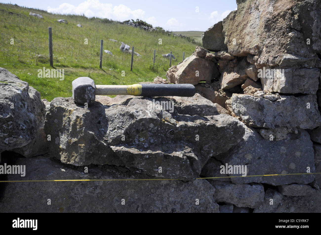 Dry stone wall repair work on the Great Orme Llandudno North Wales UK