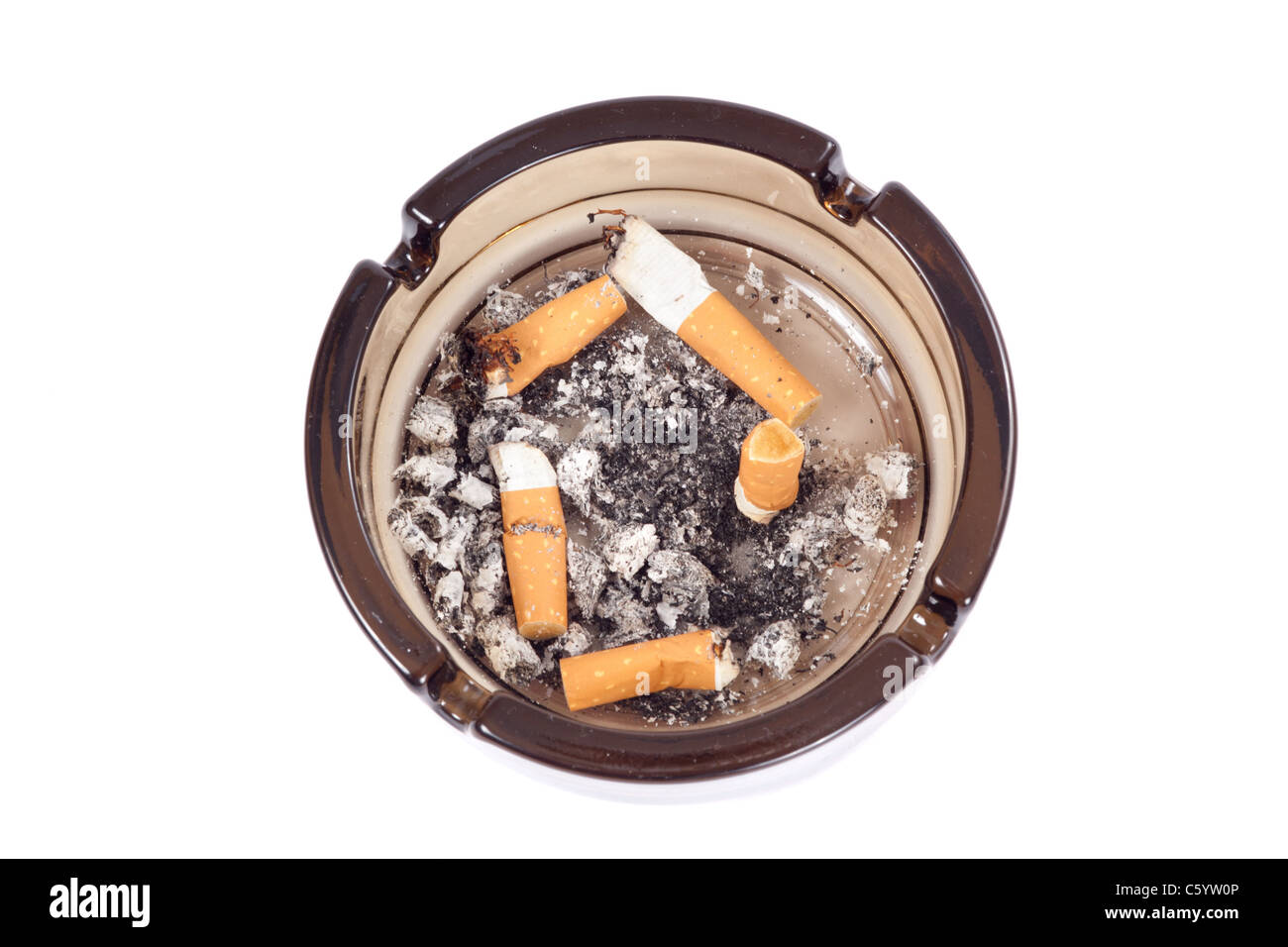 A flithy glass ash-tray, photo on the white background Stock Photo