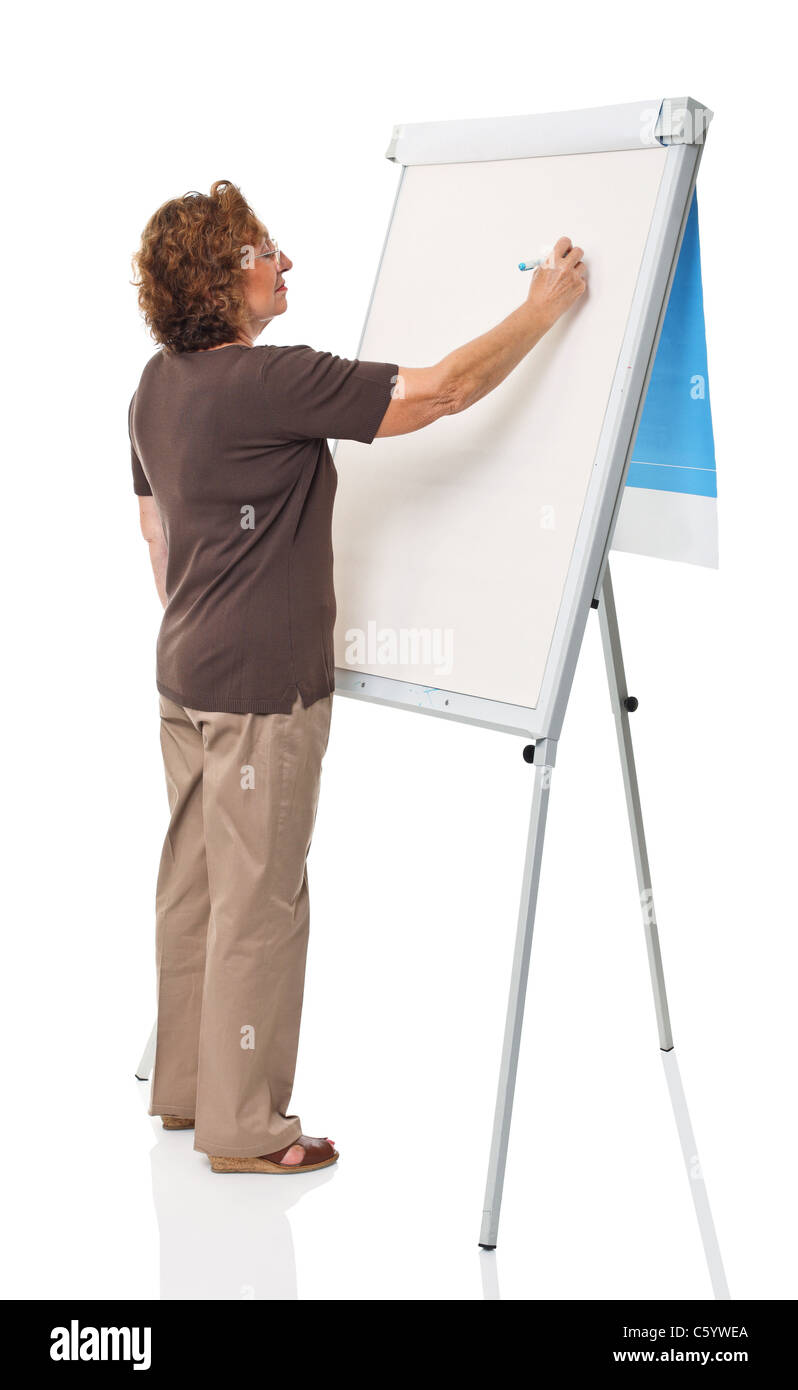 portrait of senior woman writing on white board Stock Photo