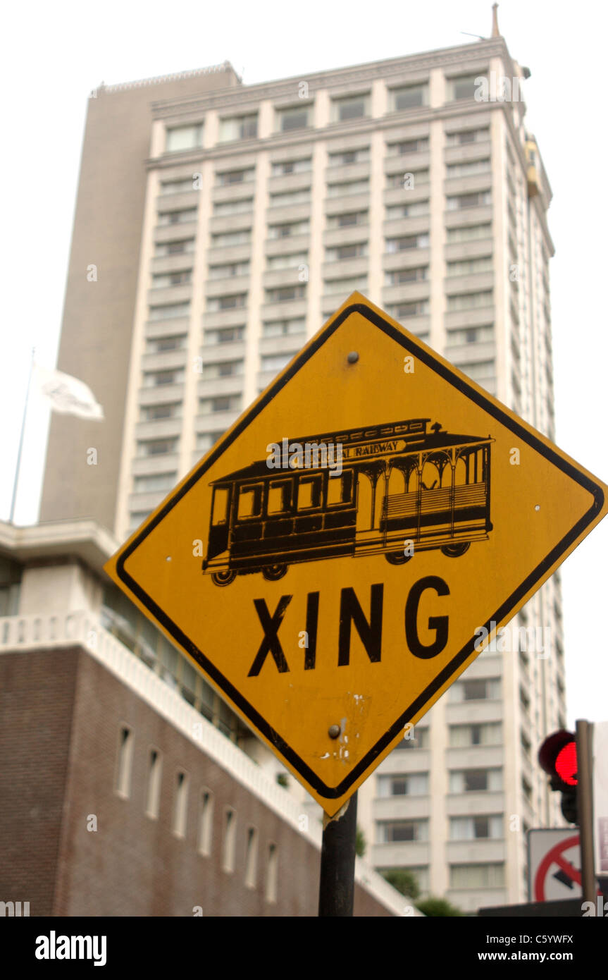 Cable Car Crossing sign on Powell Street in San Francisco with the San Francisco Fairmont in the background Stock Photo