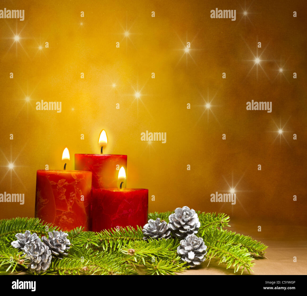 Candles decorated branches of a pine tree and fir cones, with space for ...