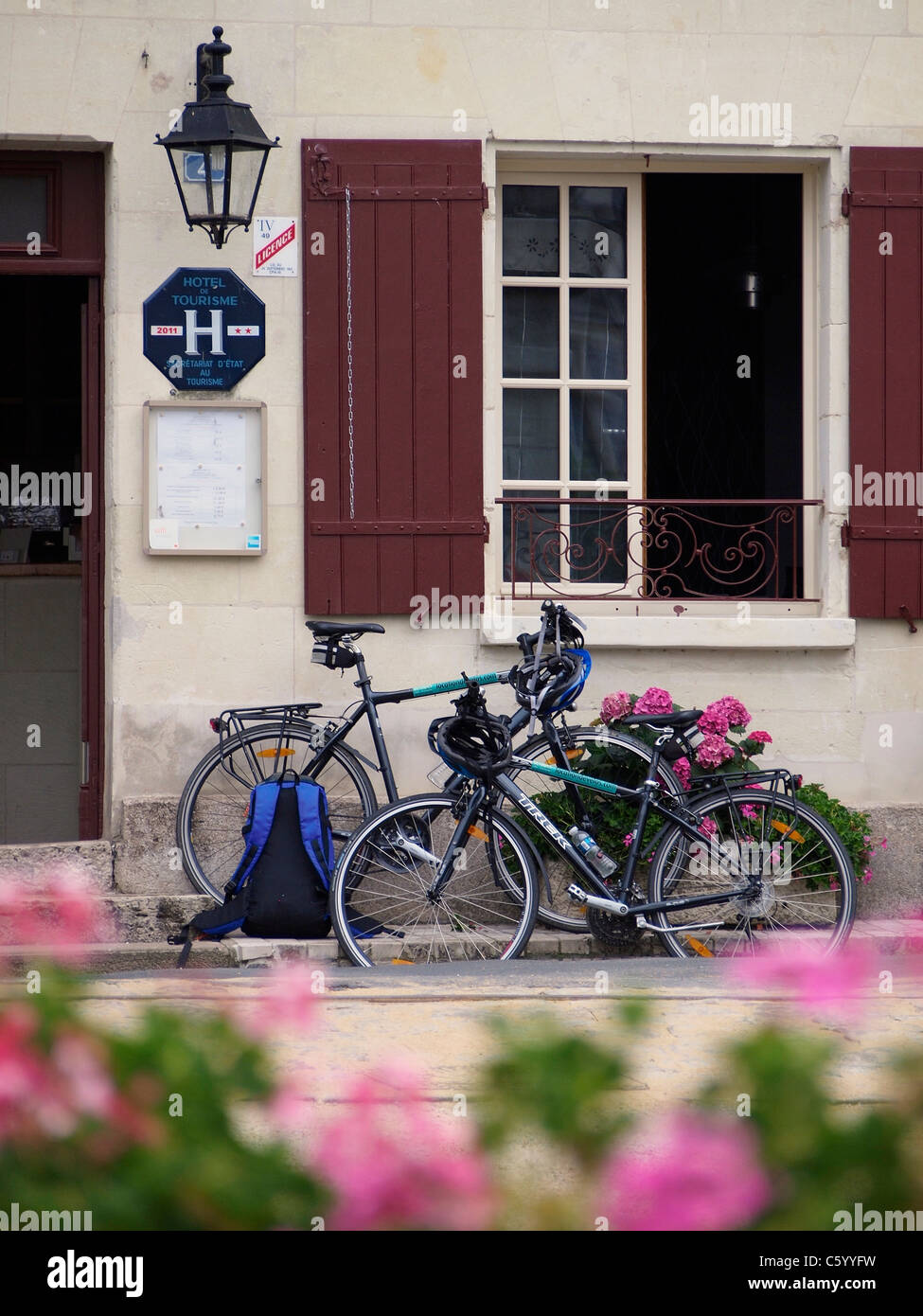 Sports touring bicycles parked in front of a small hotel in Montsoreau, Loire Valley, France Stock Photo
