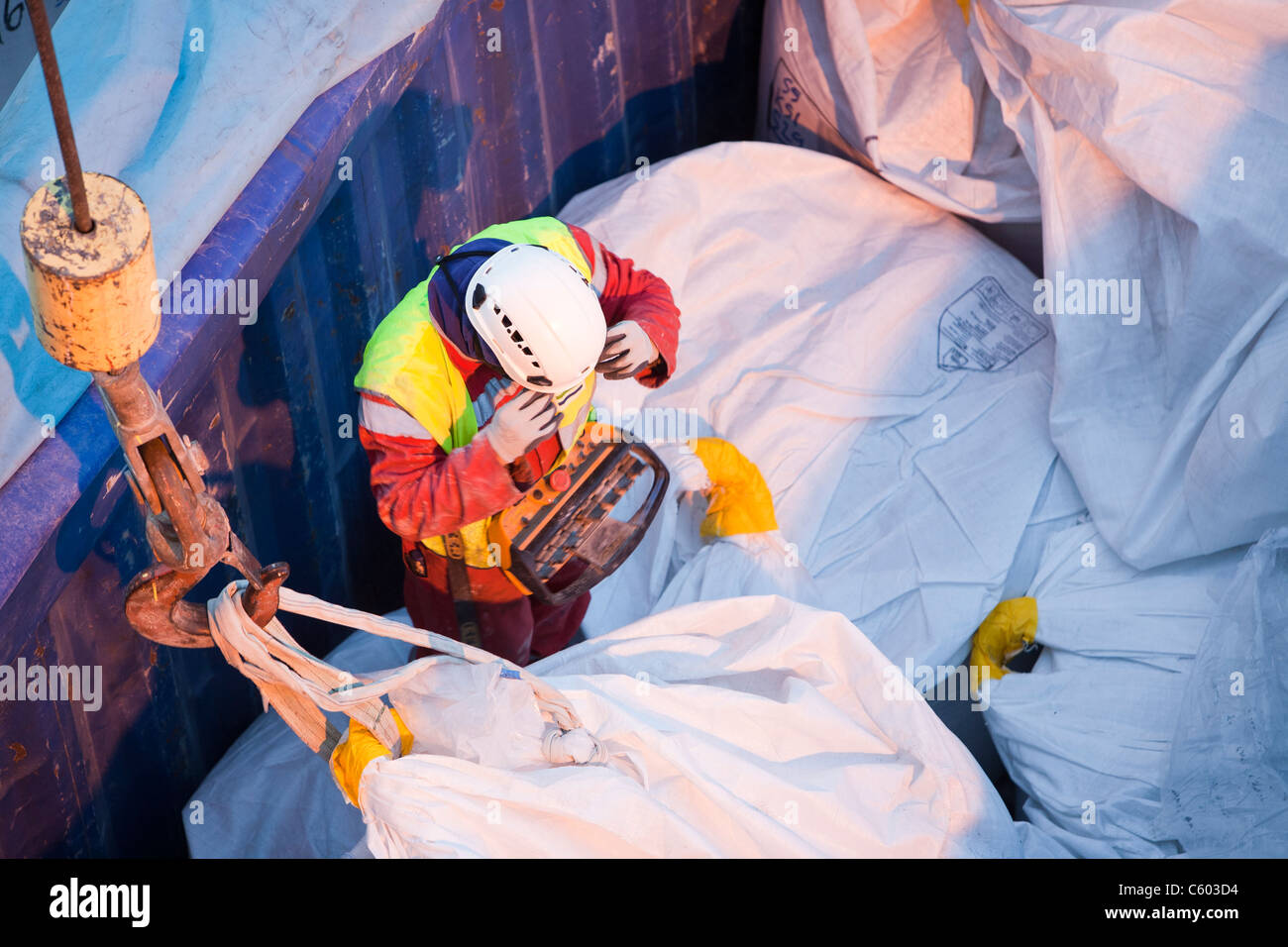 lifting bags of specialist grout to fix wind turbine pieces into place