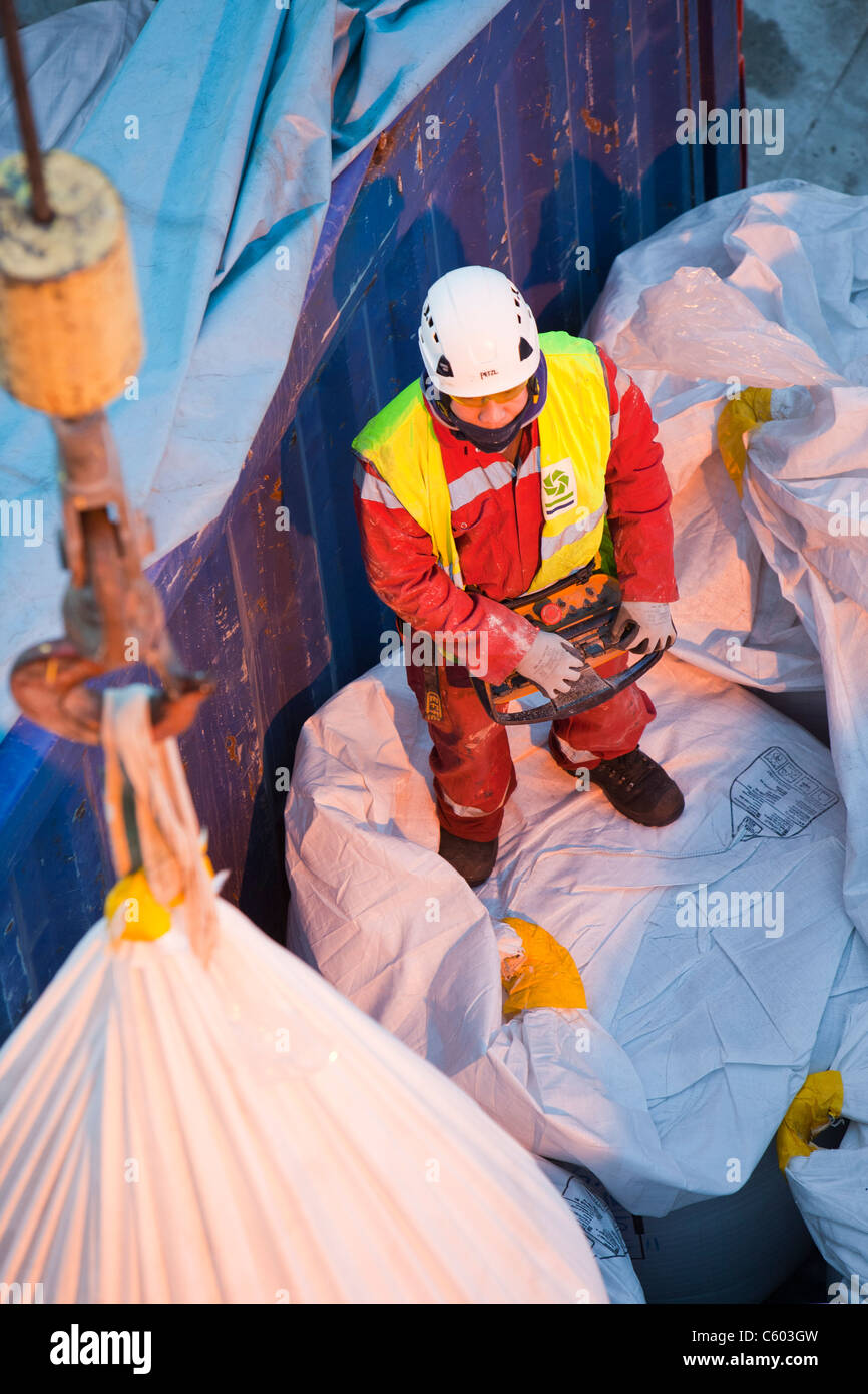 lifting bags of specialist grout to fix wind turbine pieces into place