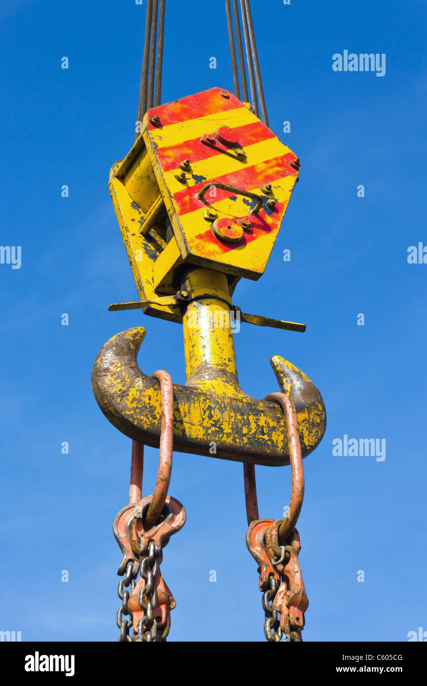 industrial crane hook on blue sky Stock Photo