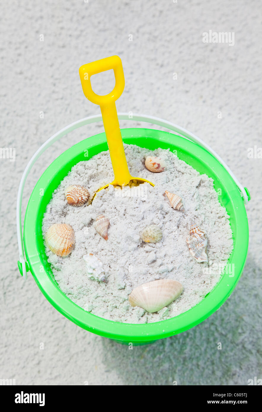 USA, Florida, St. Pete Beach, Bucket filled with sand an sea shells on ...