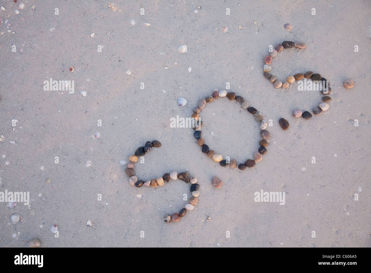 USA, Florida, St. Pete Beach, SOS writing in pebbles on sand Stock Photo