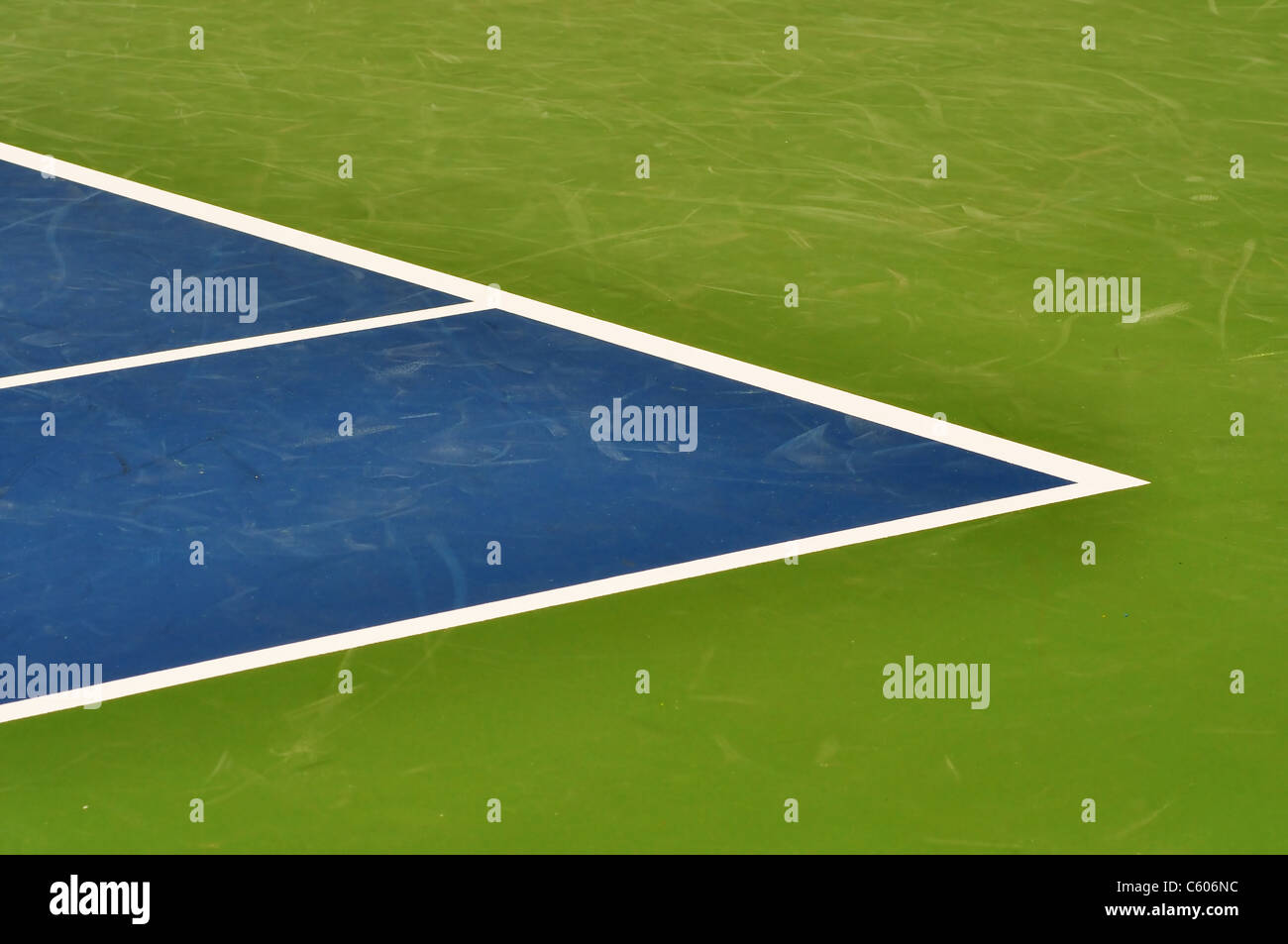 Synthetic tennis court boundary line with great details of the marks left by previous players shoes, great sport background. Stock Photo