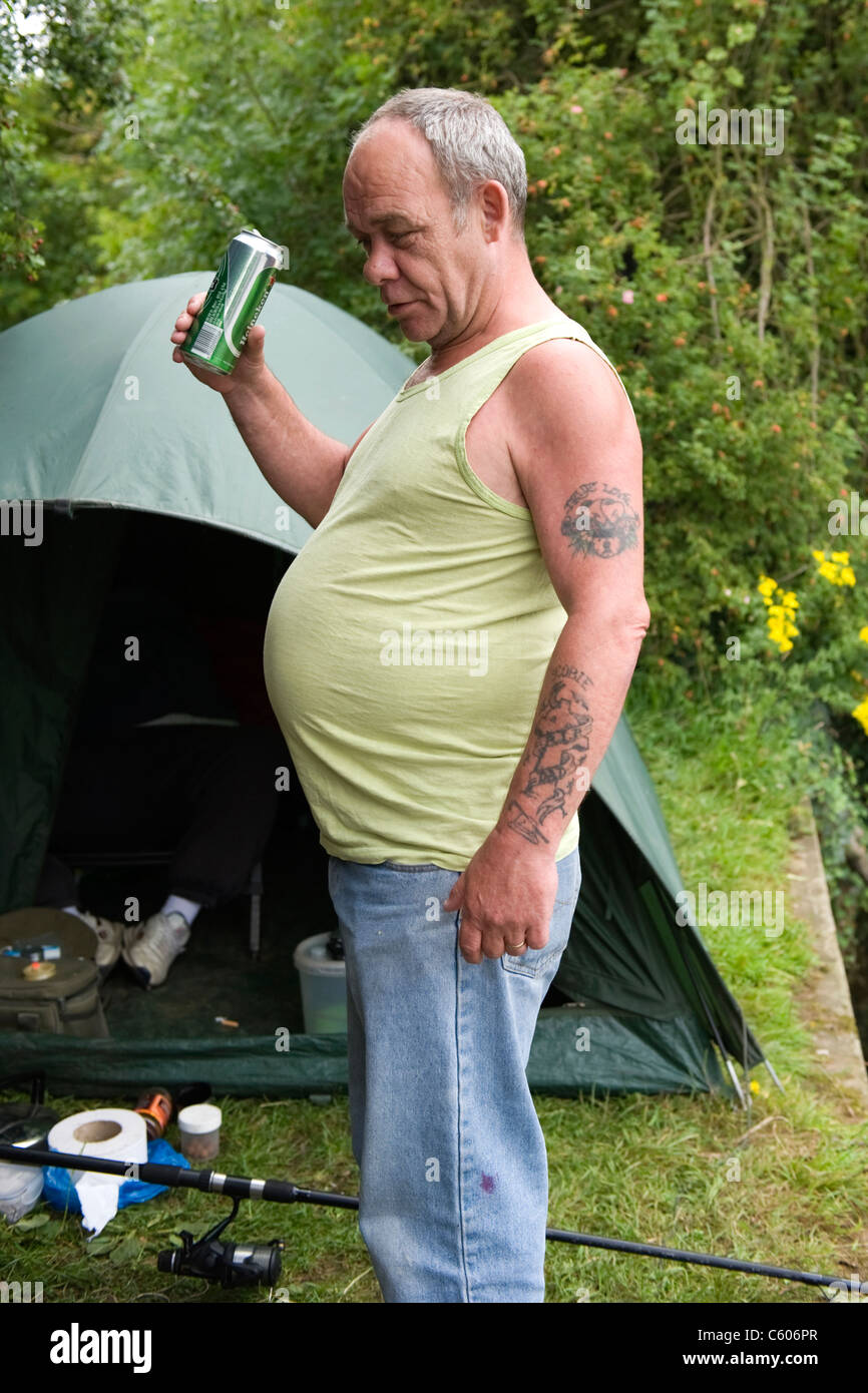 London Parliament Hill Hampstead Heath portrait fat obese beer belly angler or fisherman drinking beer Stock Photo