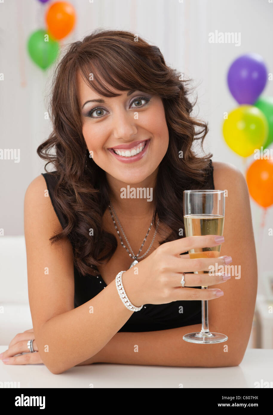 USA, Illinois, Metamora, Woman holding flute of champagne at party Stock Photo