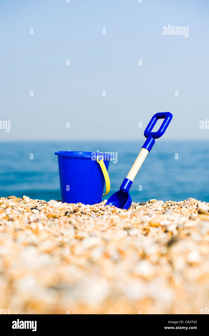 Blue Childrens Toy Bucket and Spade on the Beach Stock Photo Alamy