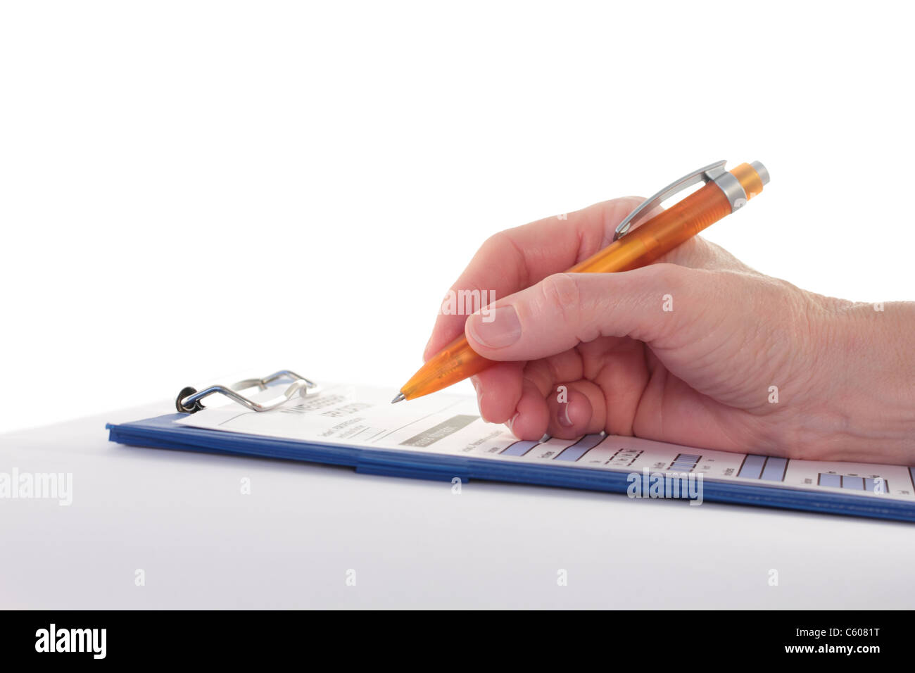 Hand Completing a Form on Clipboard Stock Photo - Alamy