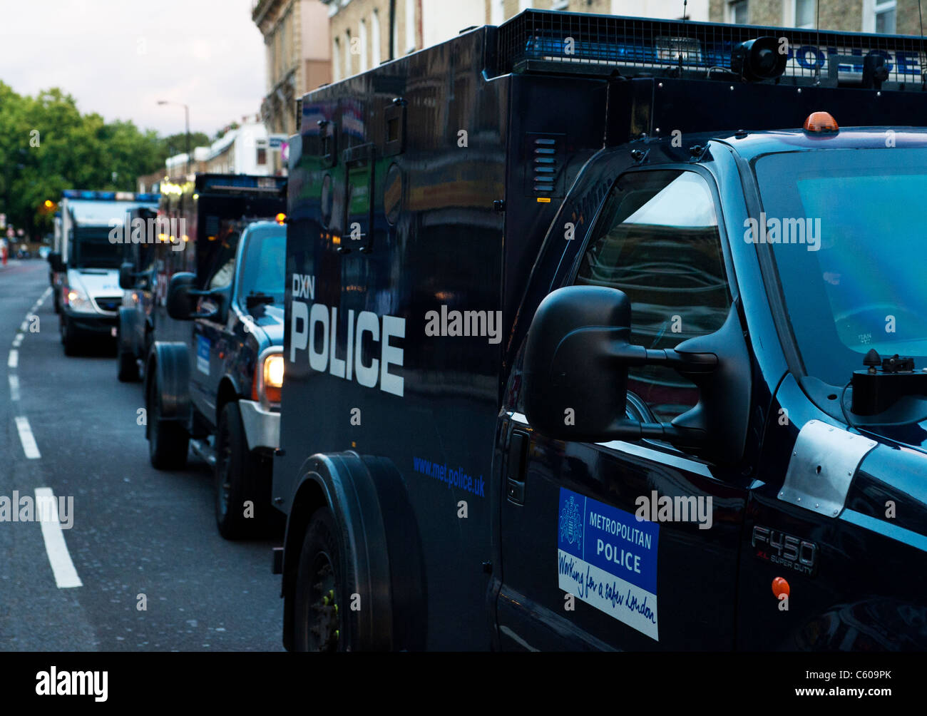 Police driving Camberwell Church Street, during the London Riots August 2011 Stock Photo
