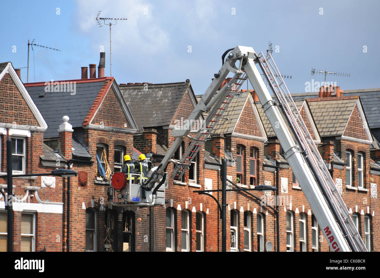 London Riots Clapham Junction burnt out shop rioting looting fire clean